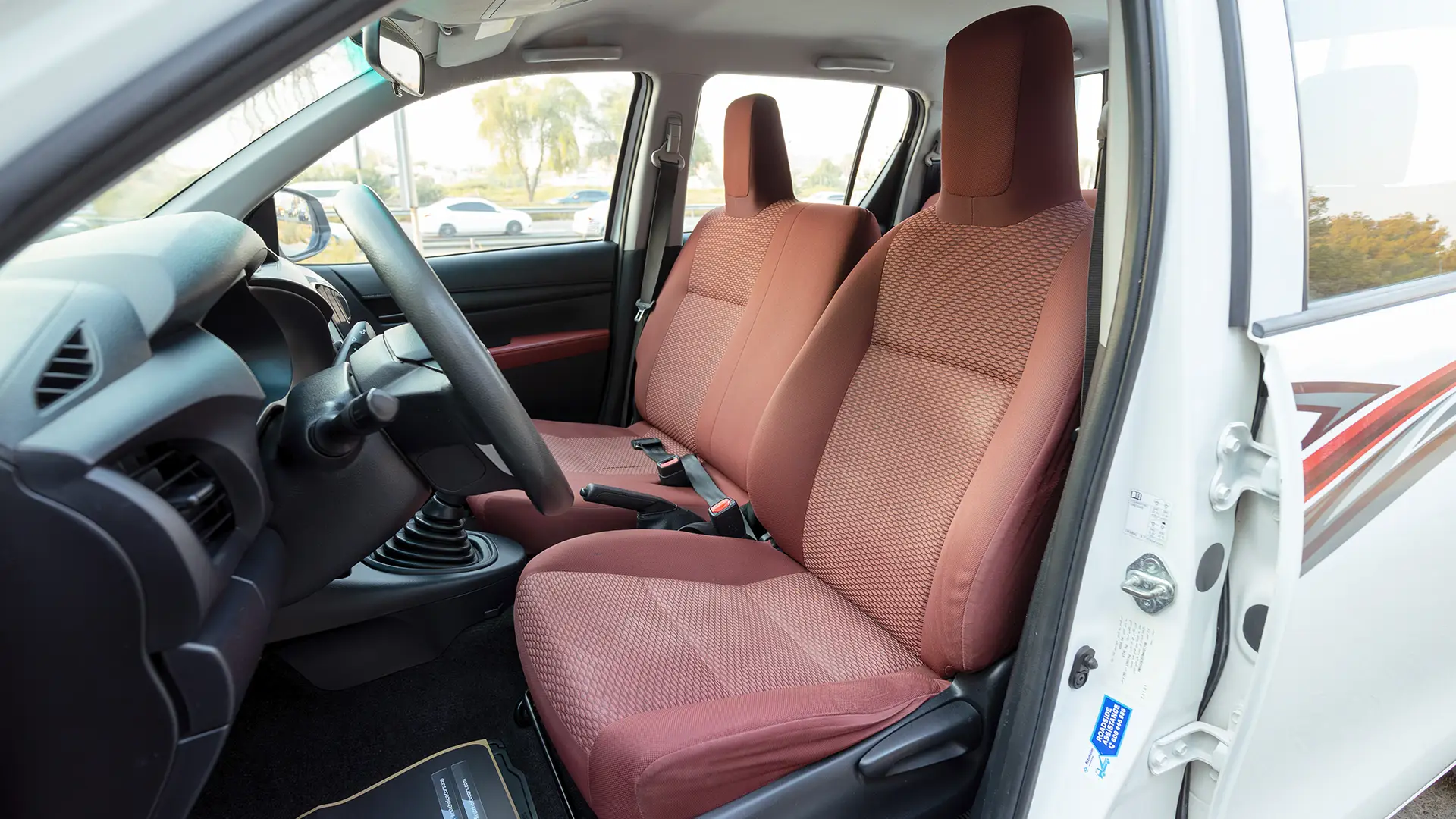 Used 2022 Toyota Hilux GLX Double Cabin in White – Front Driver Side Cabin View for Sale at First Choice Cars Dubai Sharjah
