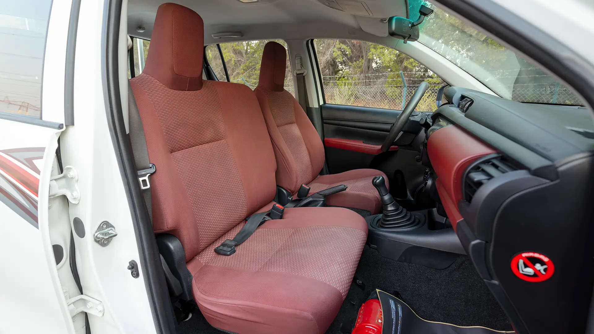 Used 2022 Toyota Hilux GLX Double Cabin in White – Front Passenger Side Cabin View for Sale at First Choice Cars Dubai Sharjah