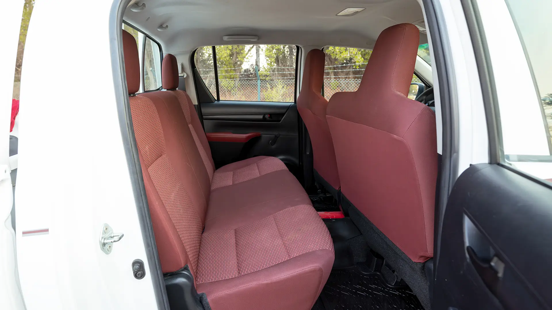 Used 2022 Toyota Hilux GLX Double Cabin in White – Rear Passenger Side Cabin View for Sale at First Choice Cars Dubai Sharjah