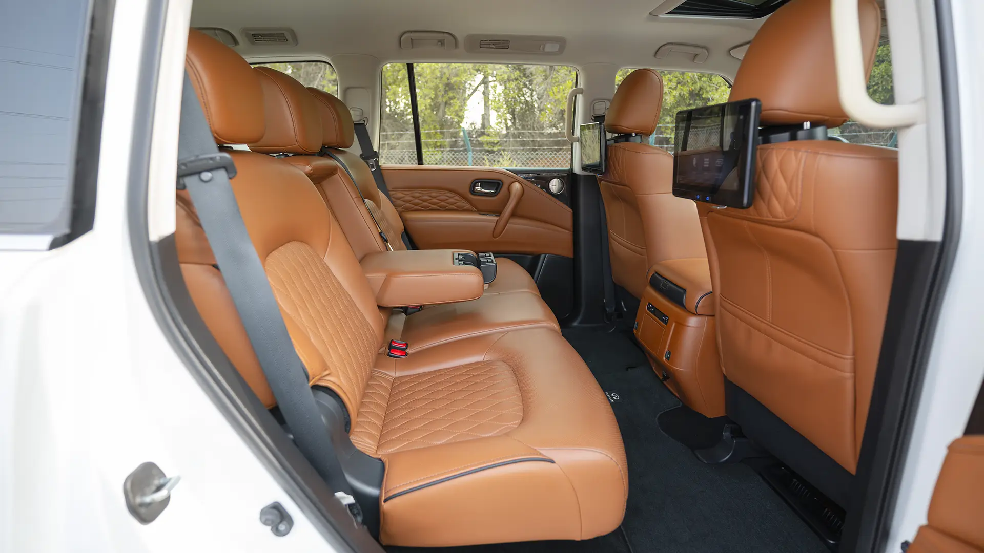 Used 2024 Infiniti QX80 Sensory in White – Rear Passenger Side Cabin View for Sale at First Choice Cars Dubai Sharjah
