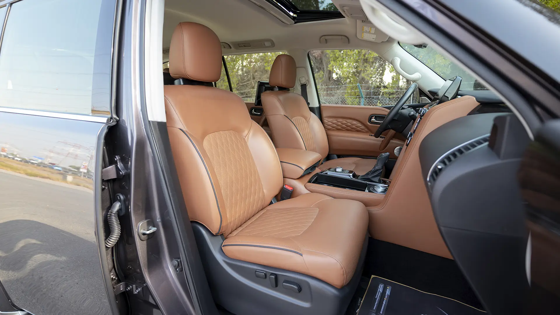 Used 2024 Infiniti QX80 Sensory in Grey – Front Passenger Side Cabin View for Sale at First Choice Cars Dubai Sharjah