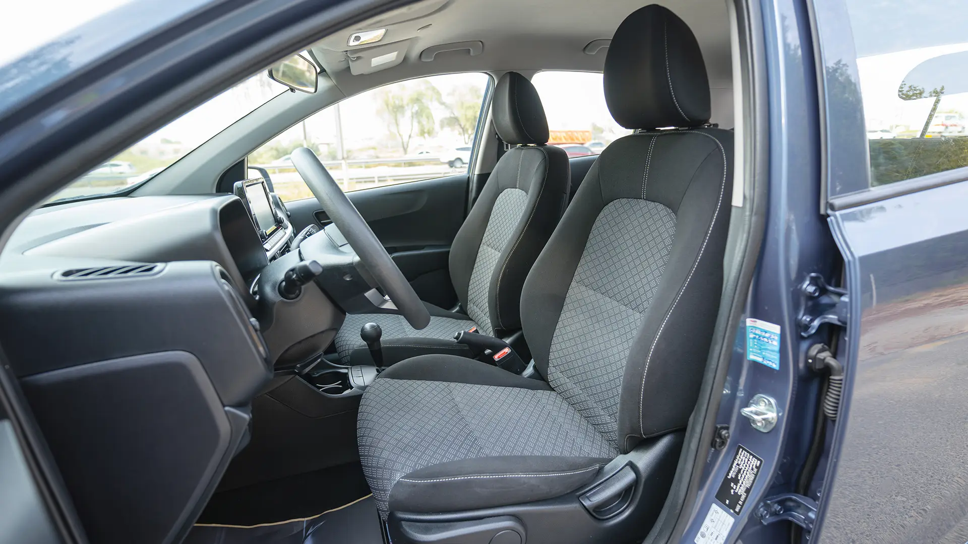 Used 2024 Kia Picanto LX in Blue – Front Driver Side Cabin View for Sale at First Choice Cars Dubai Sharjah