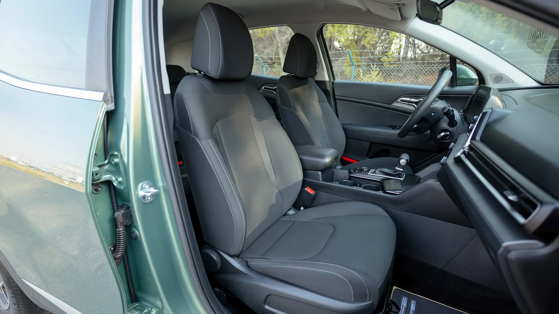Used 2025 Kia Sportage LX in Green – Front Passenger Side Cabin View for Sale at First Choice Cars Dubai Sharjah