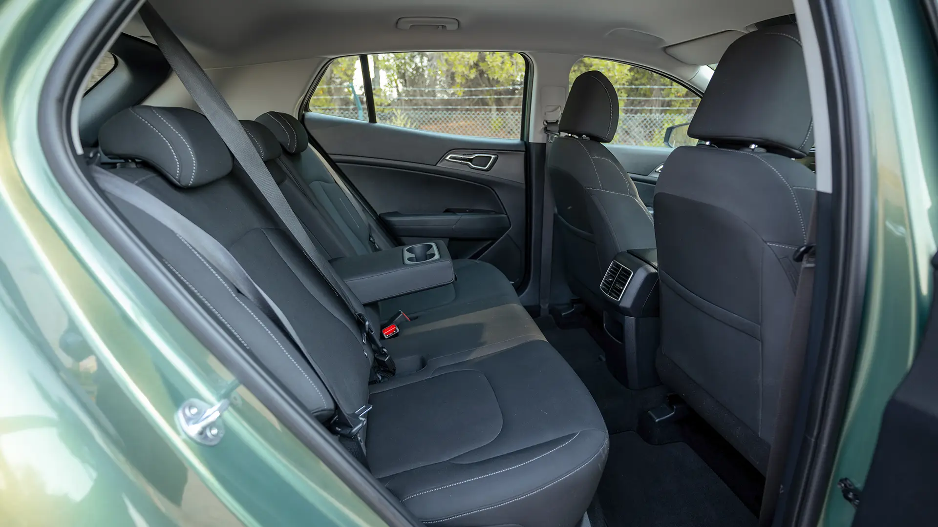 Used 2025 Kia Sportage LX in Green – Rear Passenger Side Cabin View for Sale at First Choice Cars Dubai Sharjah