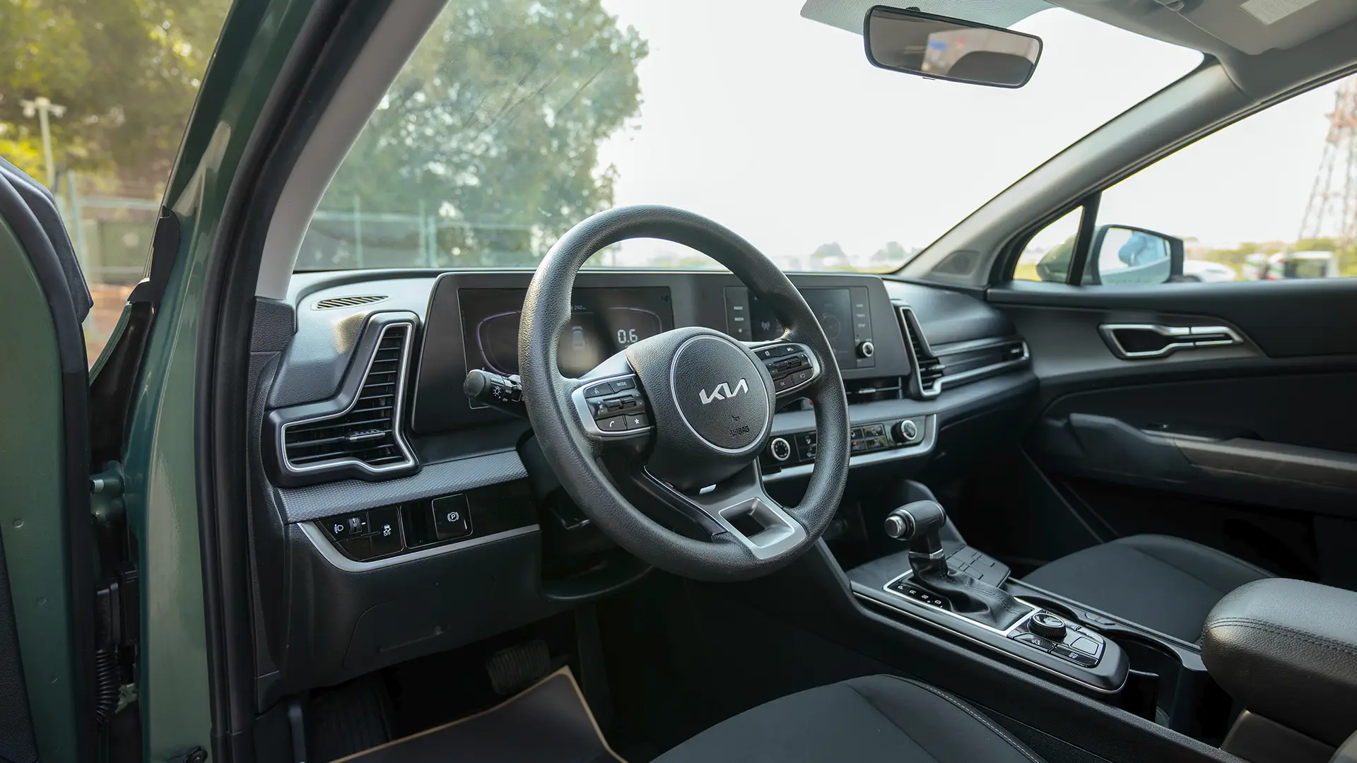 Used 2025 Kia Sportage LX in Green – Driver Side Dashboard & Steering View for Sale at First Choice Cars Dubai Sharjah