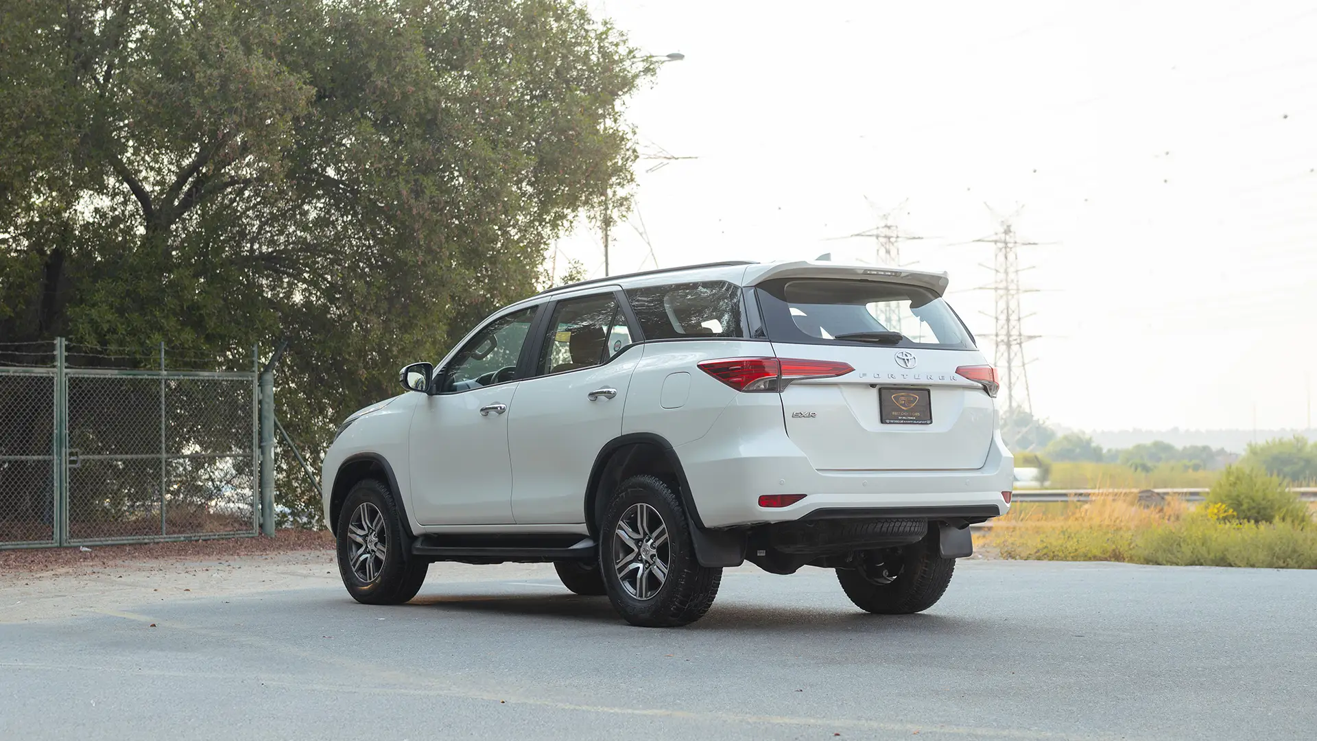 Used 2021 Toyota Fortuner EXR in White – Left Back Diagonal (45°) View for Sale at First Choice Cars Dubai Sharjah