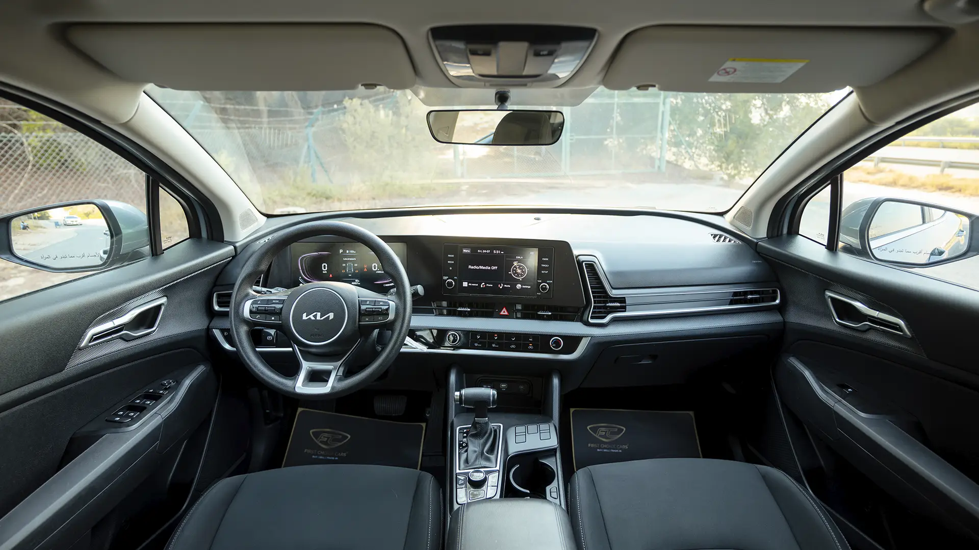 Used 2025 Kia Sportage LX in Silver – Front Cabin / Dashboard Full View for Sale at First Choice Cars Dubai Sharjah