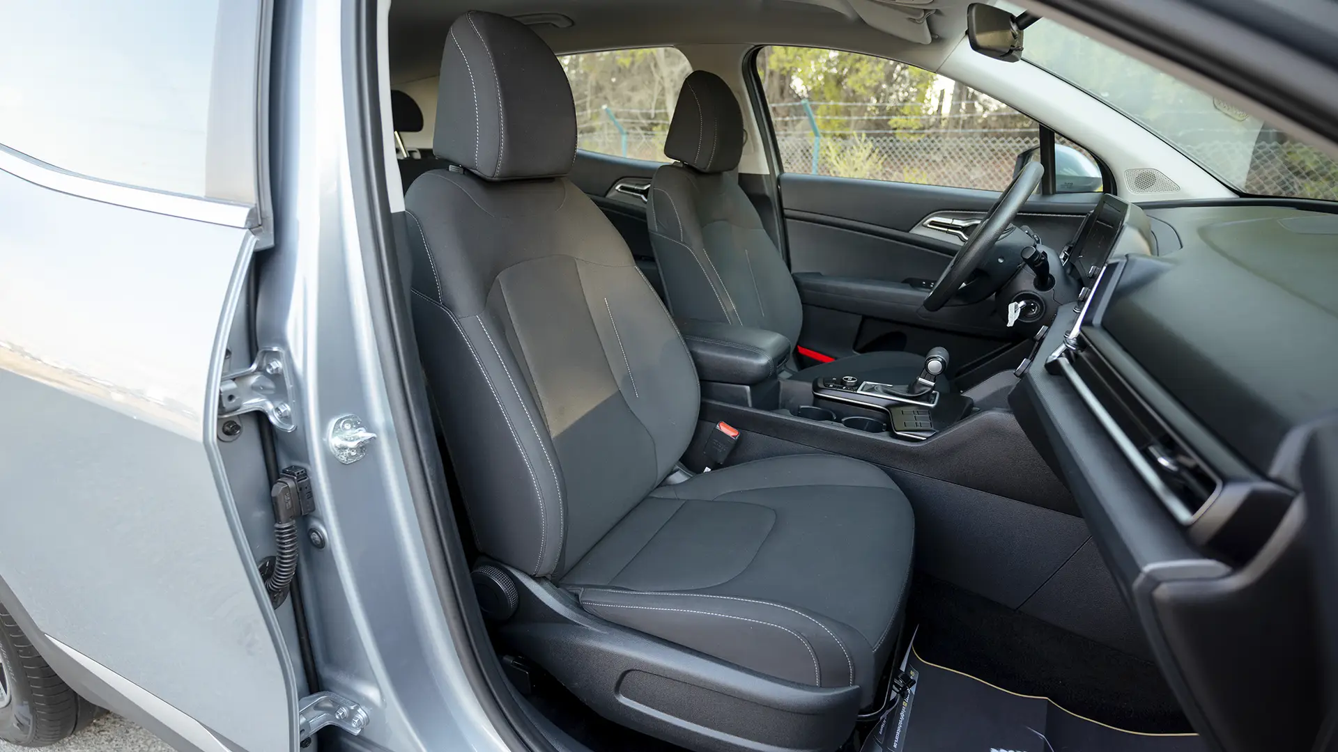 Used 2025 Kia Sportage LX in Silver – Front Passenger Side Cabin View for Sale at First Choice Cars Dubai Sharjah