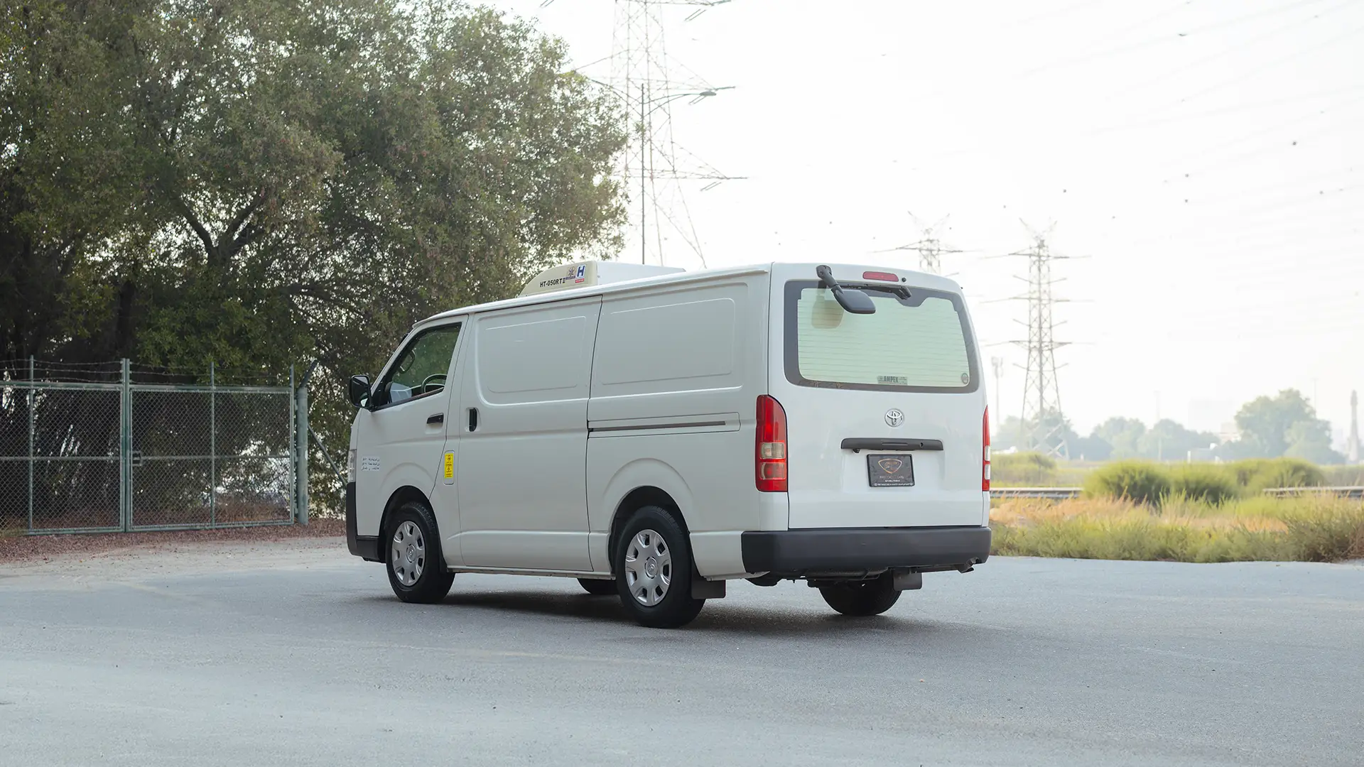 Used 2024 Toyota Hiace GL Standard Roof in White – Left Back Diagonal (45°) View for Sale at First Choice Cars Dubai Sharjah