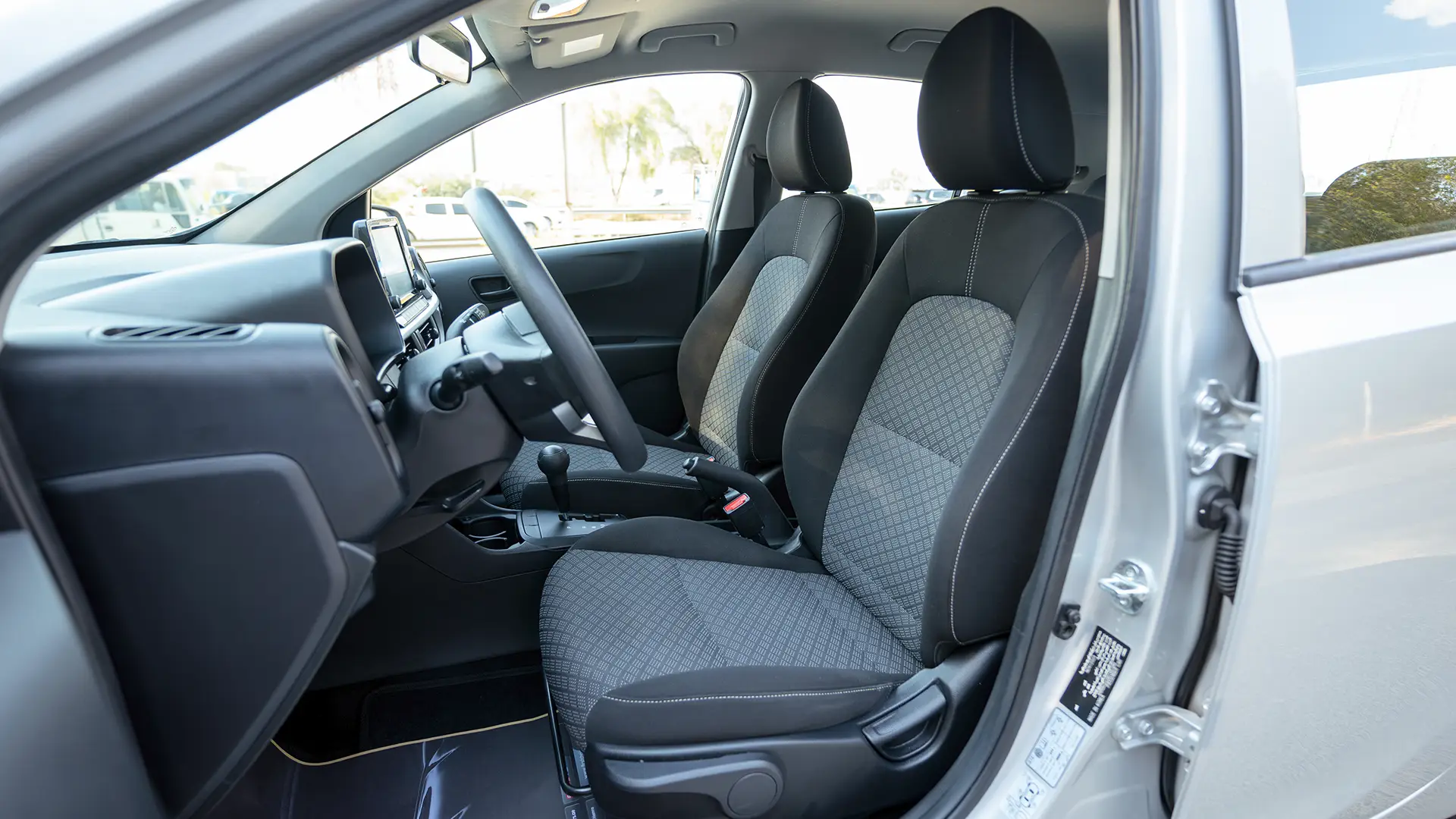 Used 2024 Kia Picanto LX in Silver – Front Driver Side Cabin View for Sale at First Choice Cars Dubai Sharjah