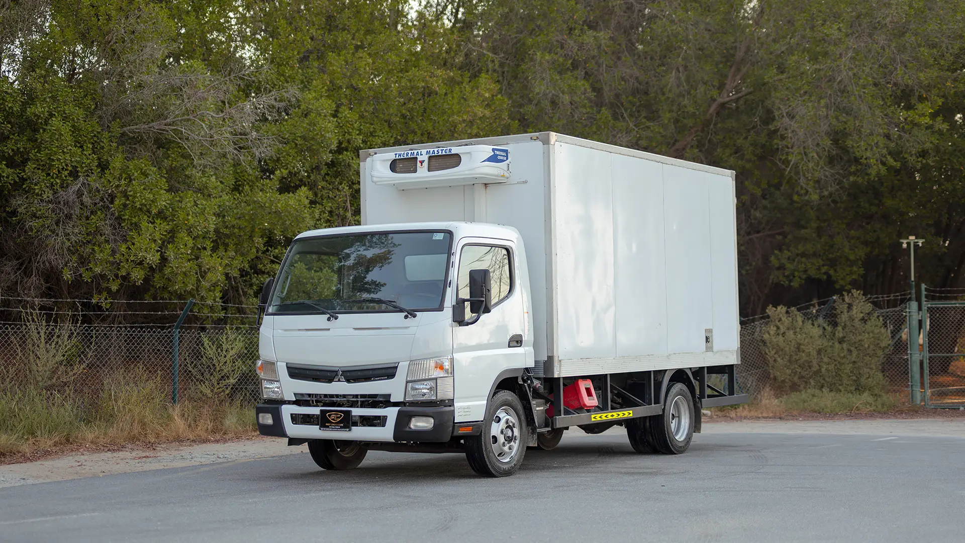 Used 2022 Mitsubishi Canter Chiller Box in White – Left Front Diagonal (45°) View for Sale at First Choice Cars Dubai Sharjah