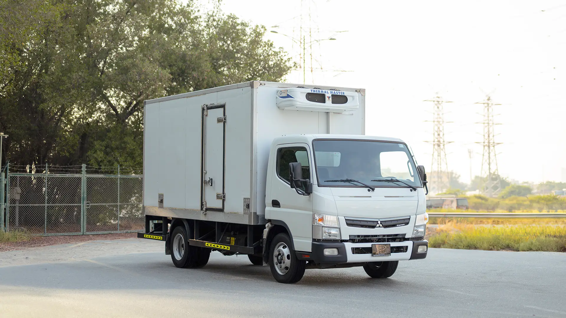 Used 2022 Mitsubishi Canter Chiller Box in White – Right Back Diagonal (45°) View for Sale at First Choice Cars Dubai Sharjah