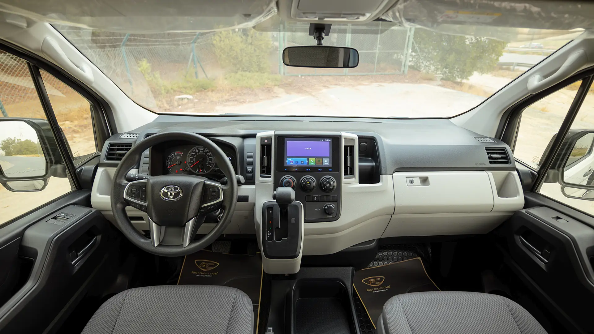 Used 2026 Toyota Hiace GL High Roof in White – Front Cabin / Dashboard Full View for Sale at First Choice Cars Dubai Sharjah