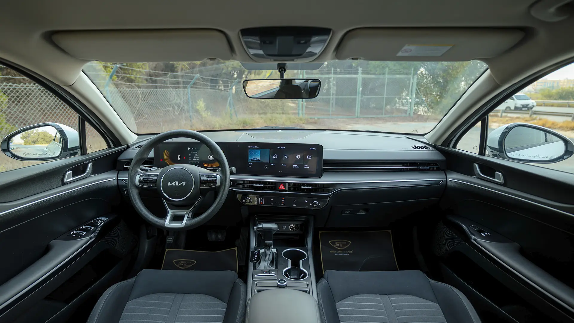 Used 2024 Kia K5 LX in White – Front Cabin / Dashboard Full View for Sale at First Choice Cars Dubai Sharjah