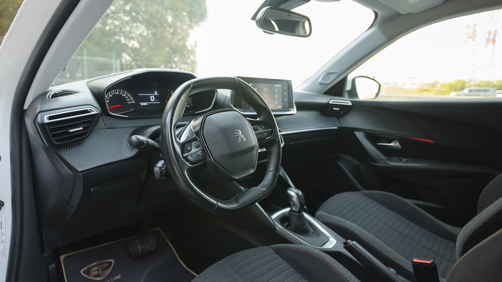 Used 2022 Peugeot 2008 Active in White – Driver Side Dashboard & Steering View for Sale at First Choice Cars Dubai Sharjah