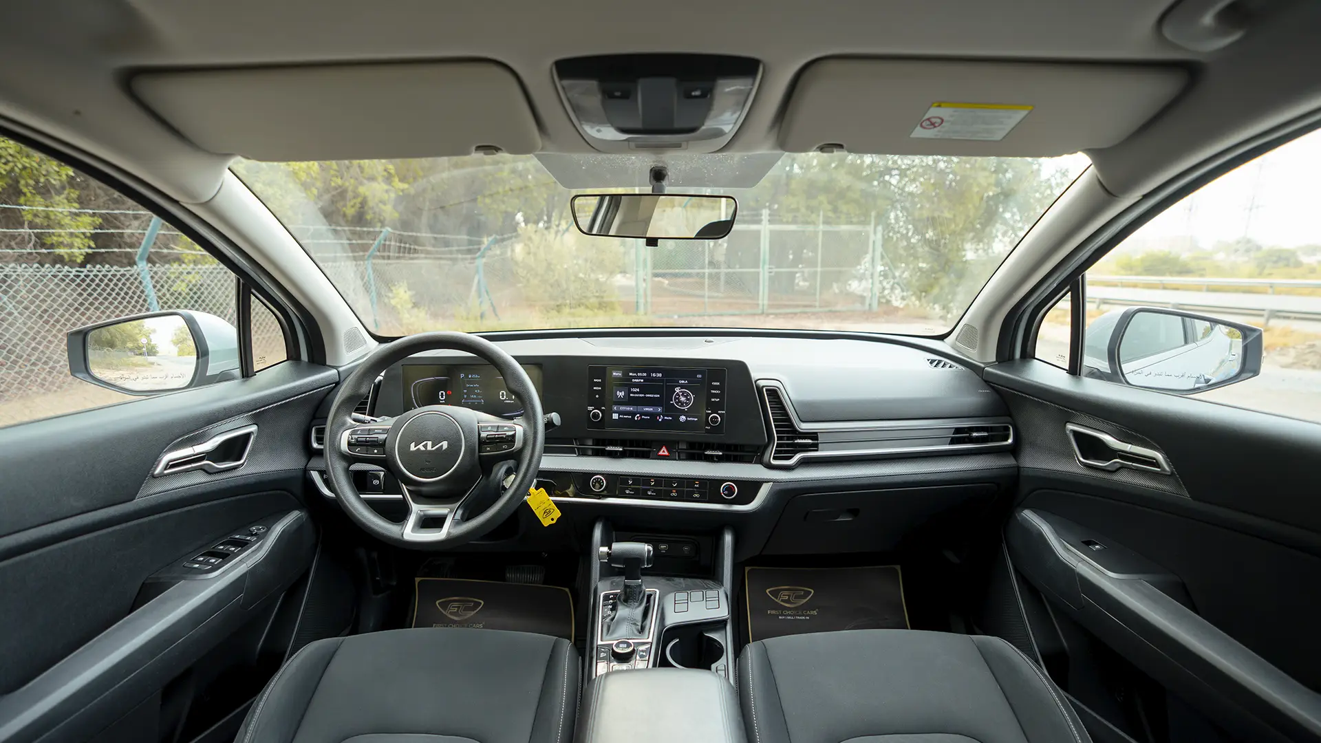 Used 2023 Kia Sportage LX in Silver – Front Cabin / Dashboard Full View for Sale at First Choice Cars Dubai Sharjah