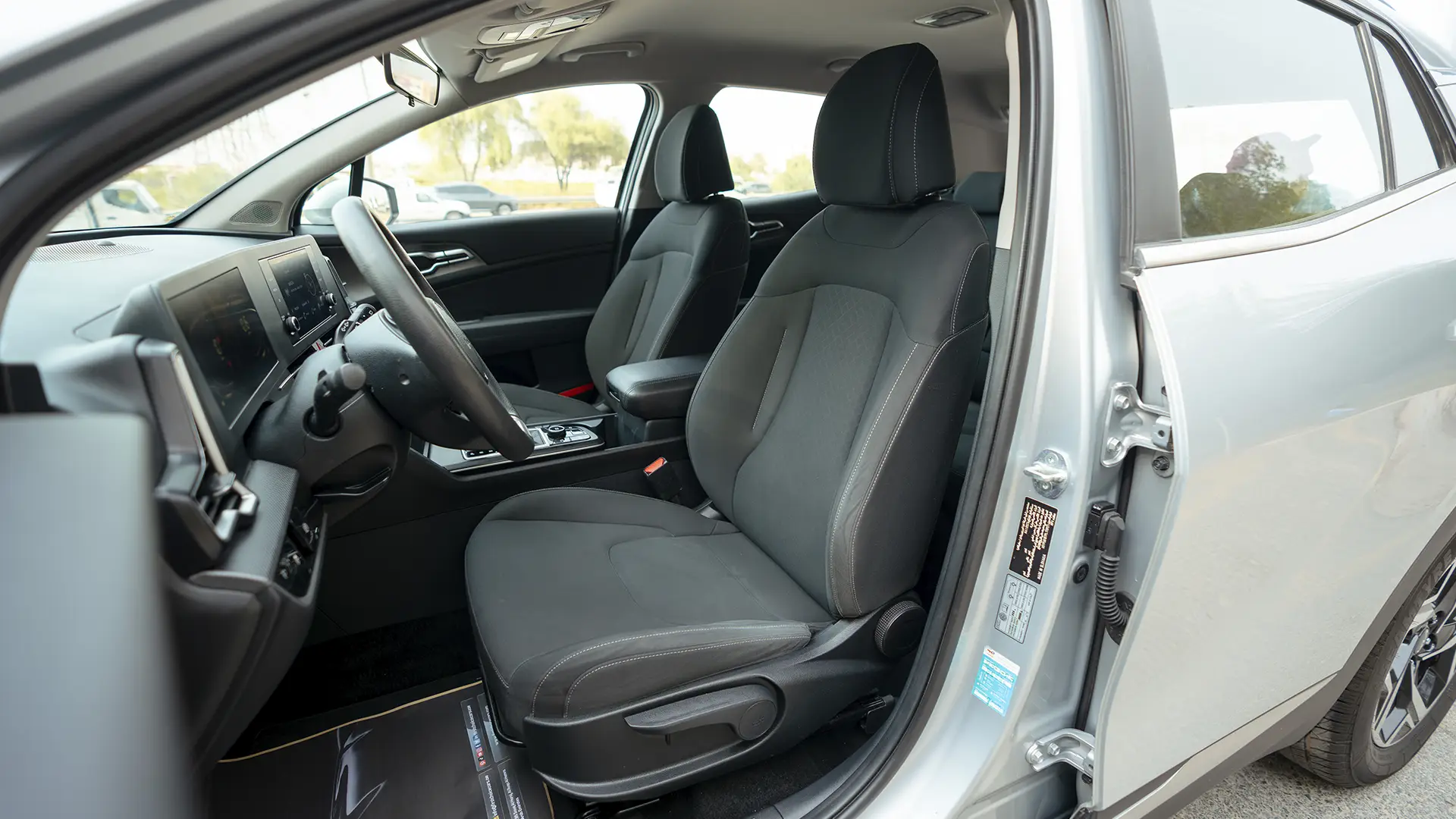 Used 2023 Kia Sportage LX in Silver – Front Driver Side Cabin View for Sale at First Choice Cars Dubai Sharjah