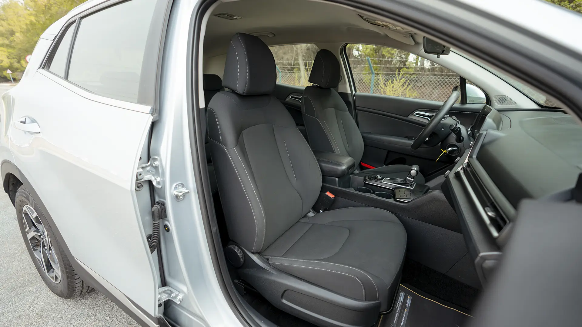 Used 2023 Kia Sportage LX in Silver – Front Passenger Side Cabin View for Sale at First Choice Cars Dubai Sharjah