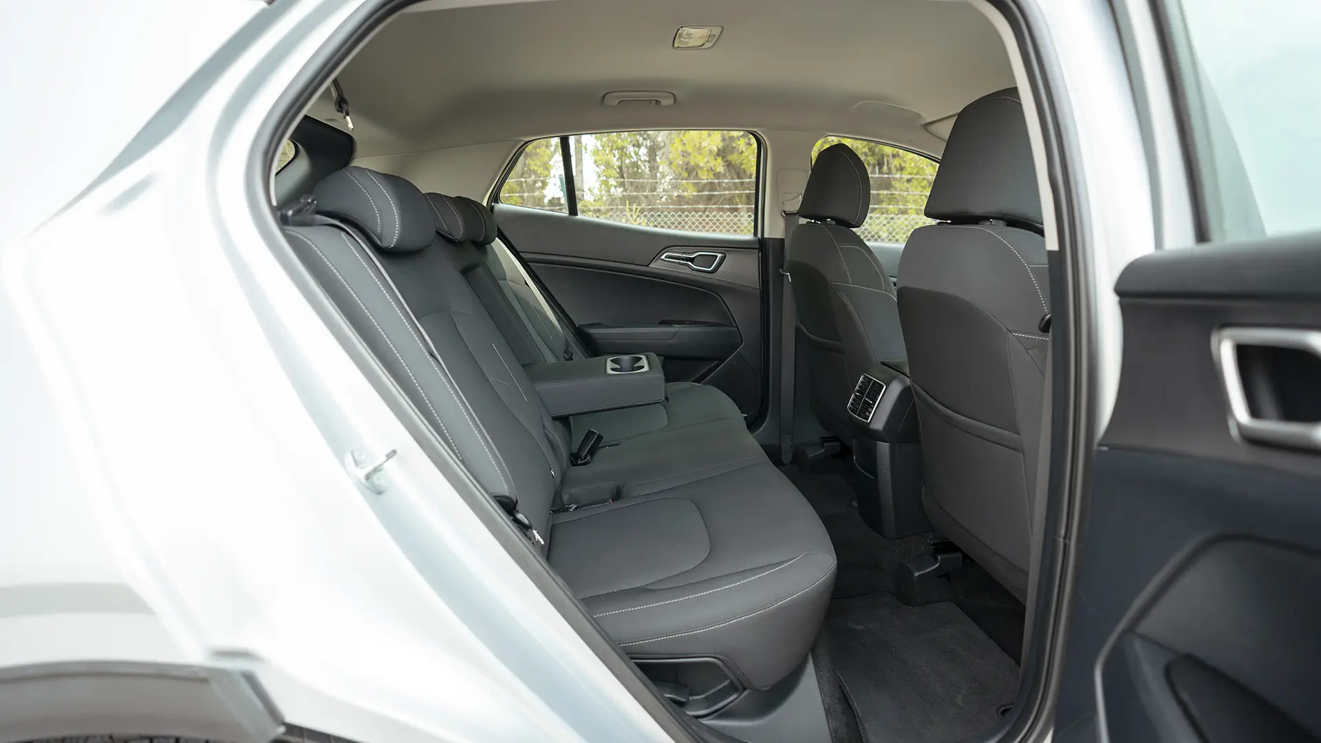 Used 2023 Kia Sportage LX in Silver – Rear Passenger Side Cabin View for Sale at First Choice Cars Dubai Sharjah