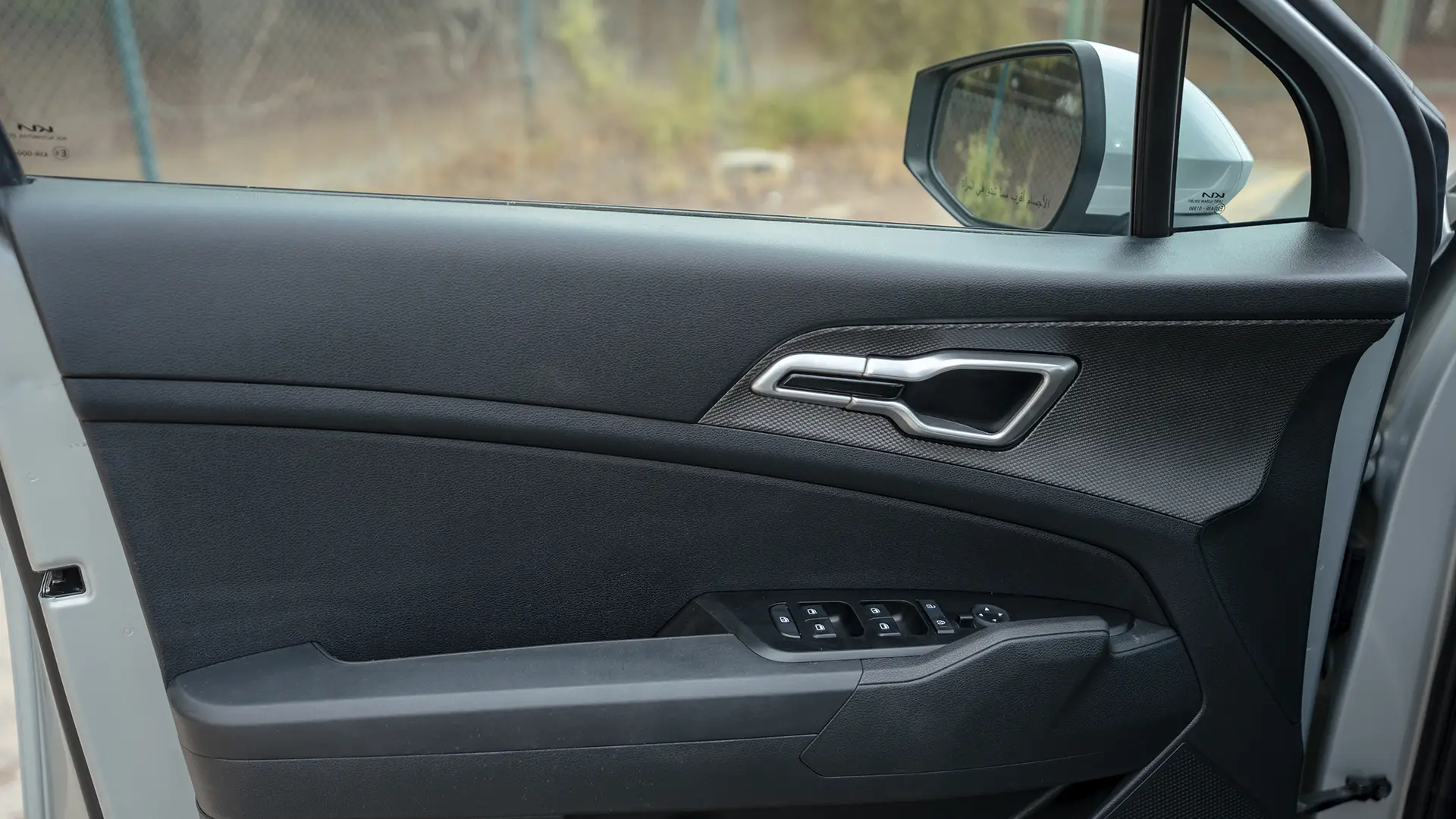 Used 2023 Kia Sportage LX in Silver – Driver Door Panel Full View for Sale at First Choice Cars Dubai Sharjah