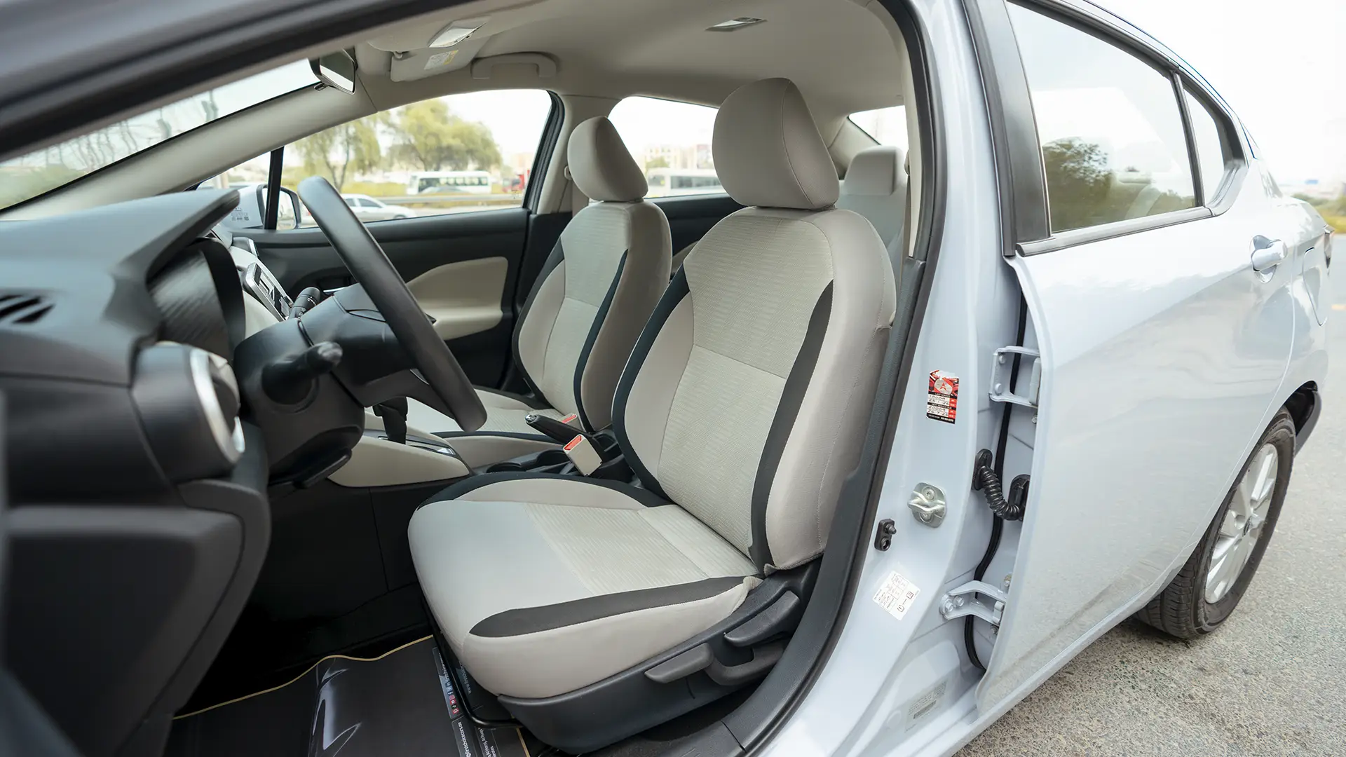 Used 2024 Nissan Sunny S in Grey – Front Driver Side Cabin View for Sale at First Choice Cars Dubai Sharjah