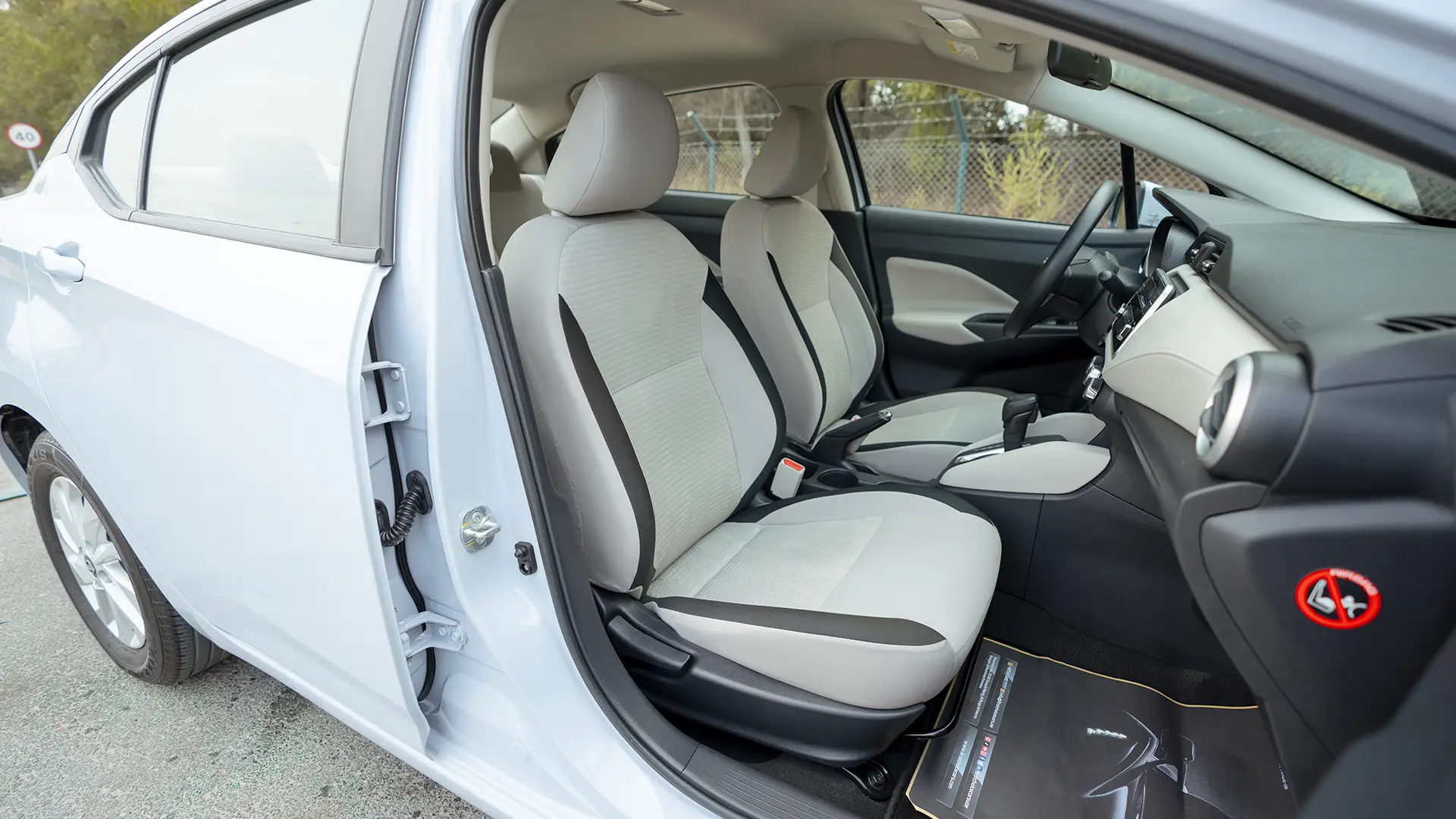 Used 2024 Nissan Sunny S in Grey – Front Passenger Side Cabin View for Sale at First Choice Cars Dubai Sharjah