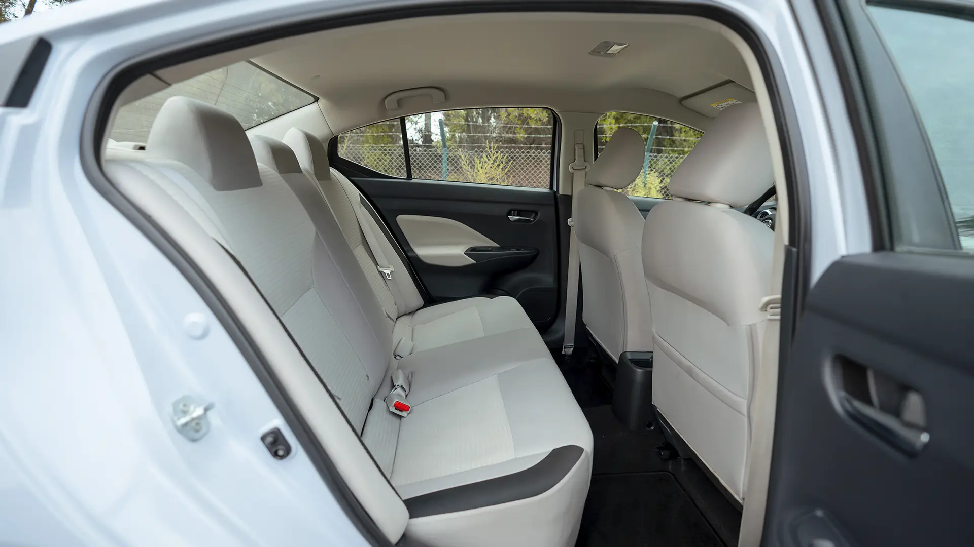 Used 2024 Nissan Sunny S in Grey – Rear Passenger Side Cabin View for Sale at First Choice Cars Dubai Sharjah