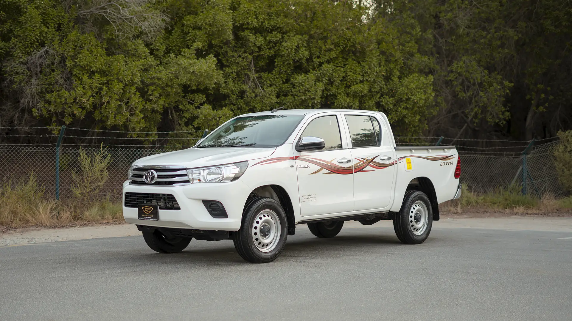 Used 2021 Toyota Hilux GLX Double Cabin in White – Left Front Diagonal (45°) View for Sale at First Choice Cars Dubai Sharjah