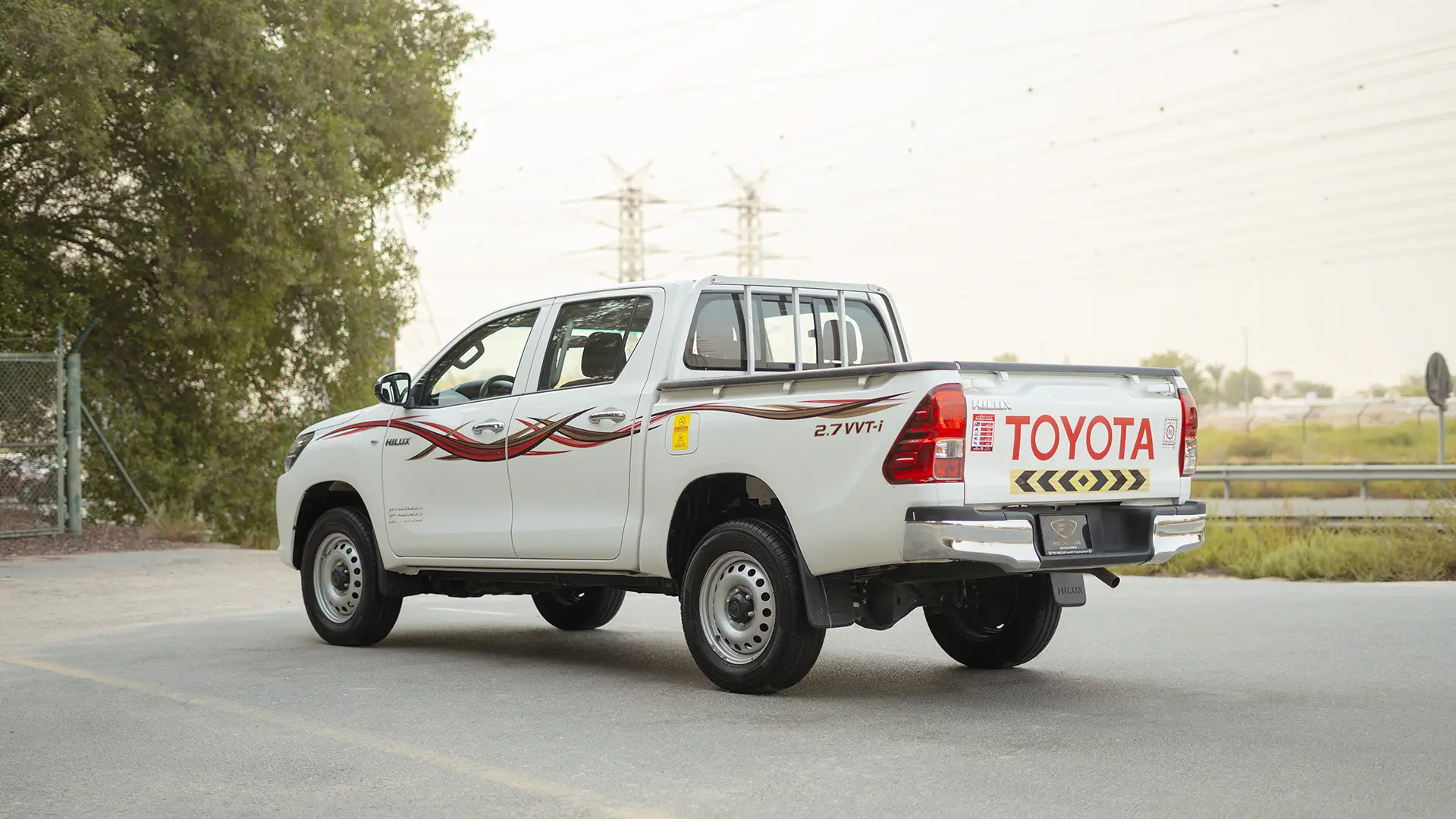 Used 2021 Toyota Hilux GLX Double Cabin in White – Left Back Diagonal (45°) View for Sale at First Choice Cars Dubai Sharjah