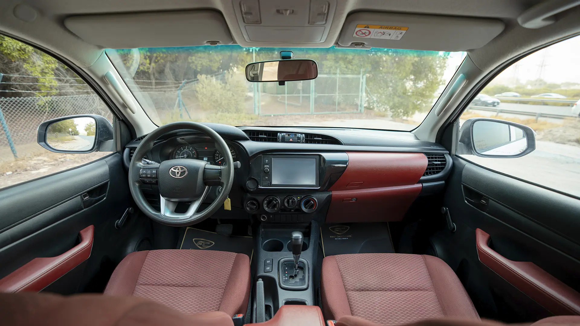 Used 2021 Toyota Hilux GLX Double Cabin in White – Front Cabin / Dashboard Full View for Sale at First Choice Cars Dubai Sharjah
