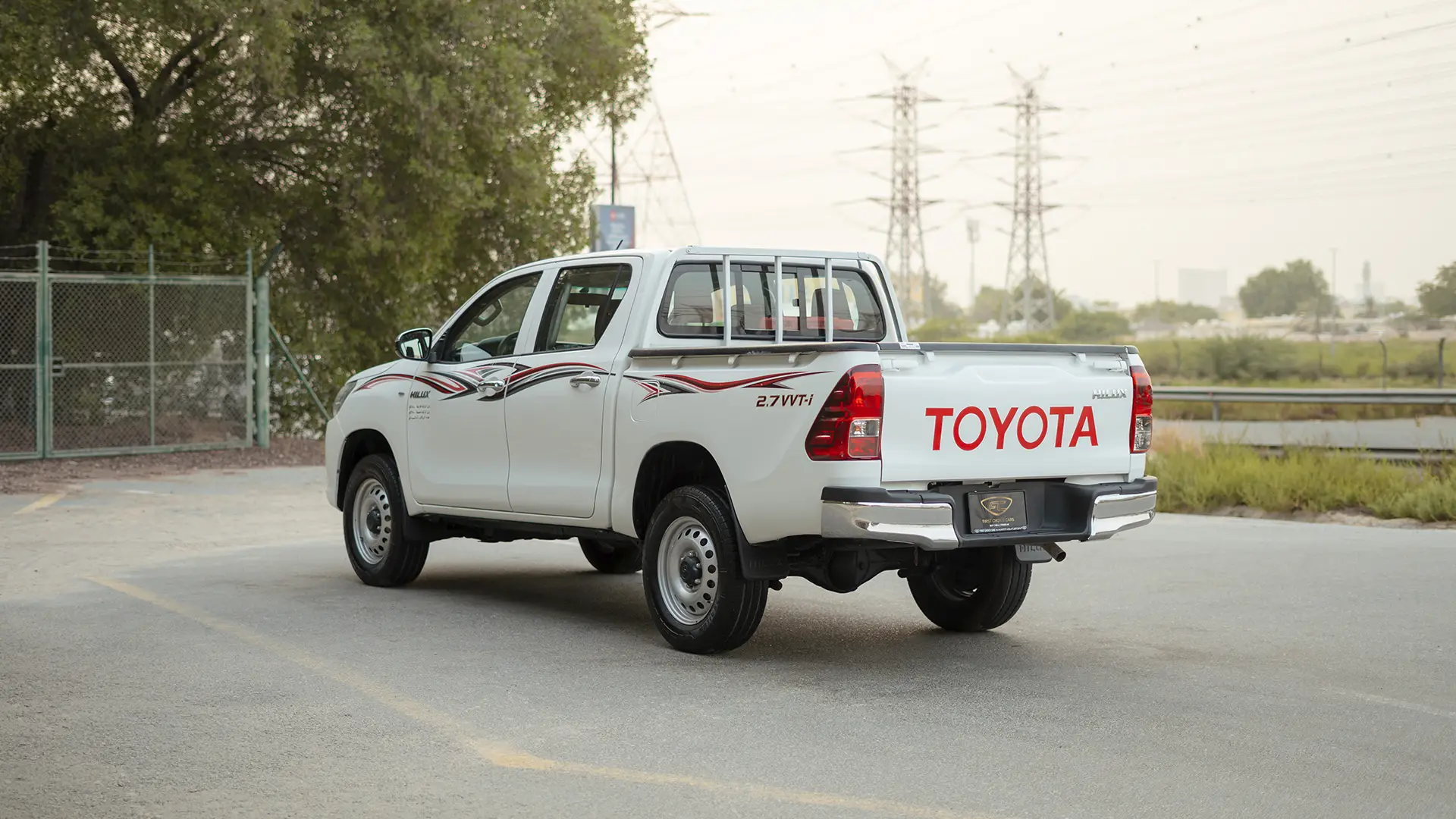 Used 2022 Toyota Hilux GLX Double Cabin in White – Left Back Diagonal (45°) View for Sale at First Choice Cars Dubai Sharjah