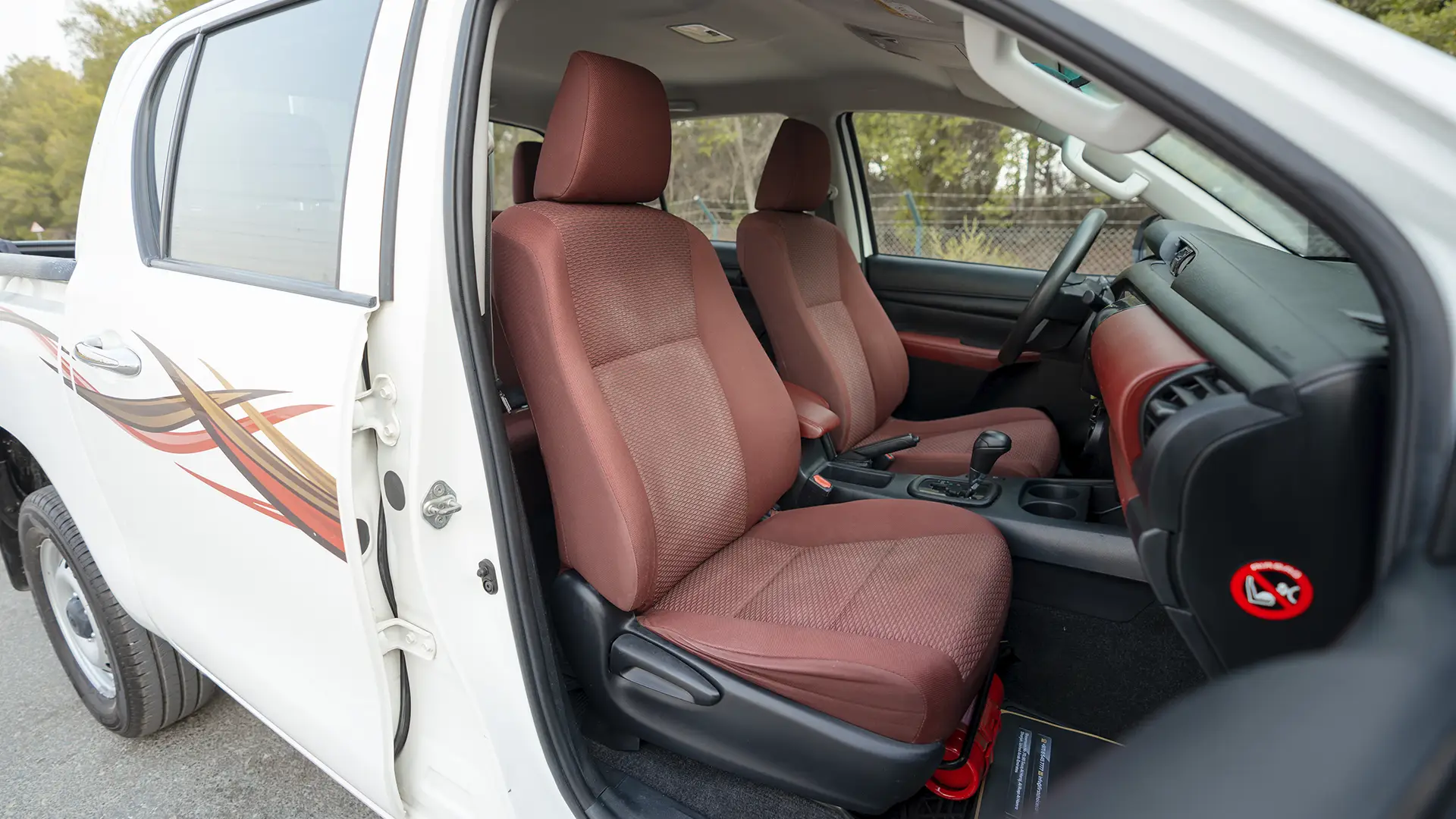 Used 2022 Toyota Hilux GLX Double Cabin in White – Front Passenger Side Cabin View for Sale at First Choice Cars Dubai Sharjah