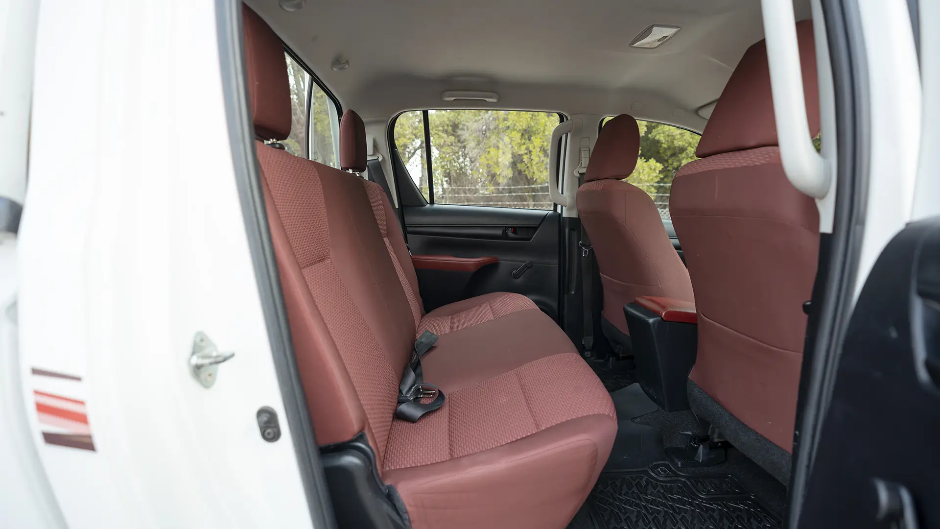 Used 2022 Toyota Hilux GLX Double Cabin in White – Rear Passenger Side Cabin View for Sale at First Choice Cars Dubai Sharjah