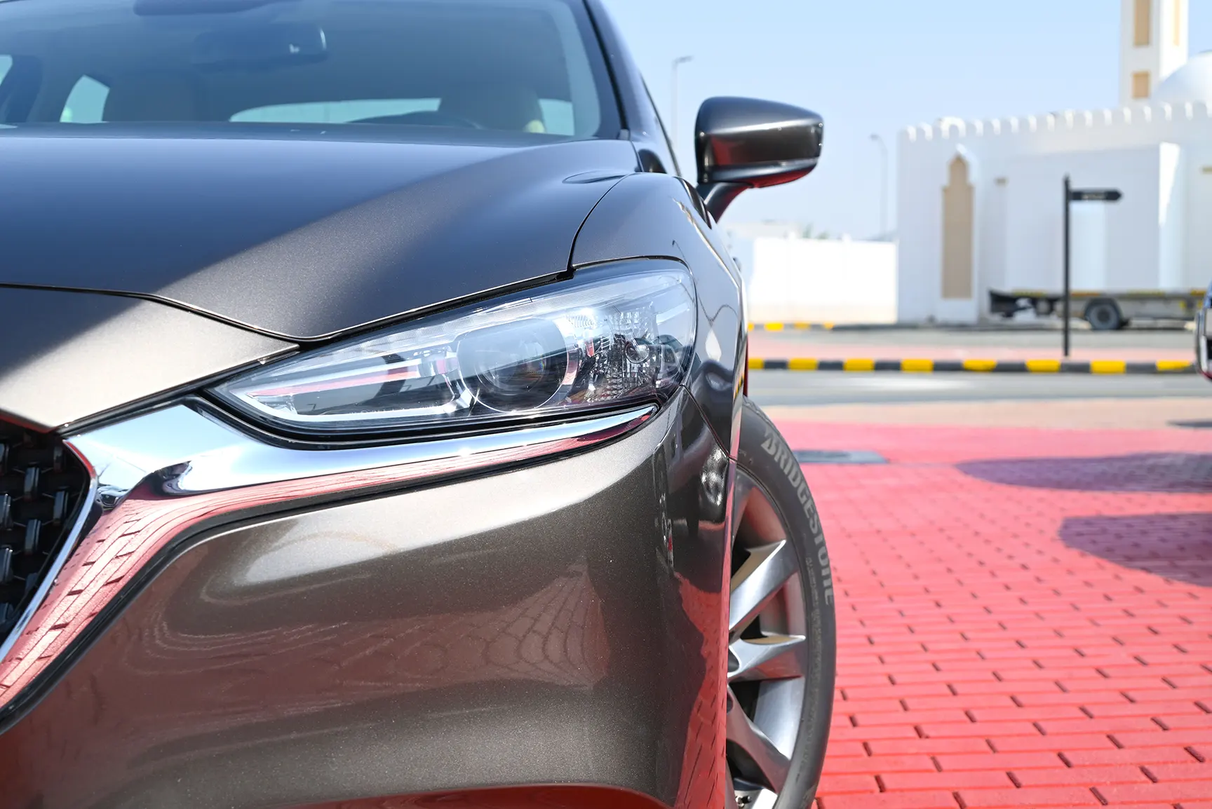 Used 2019 Mazda 6 S Grade Grey – Headlight Close-up at First Choice Cars Sharjah