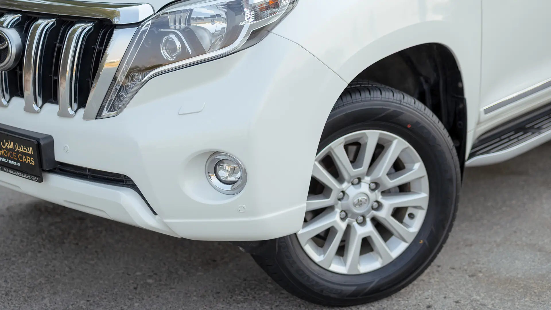 Used 2016 Toyota Prado VXR in White – Headlight Close-up for Sale at First Choice Cars Dubai Sharjah