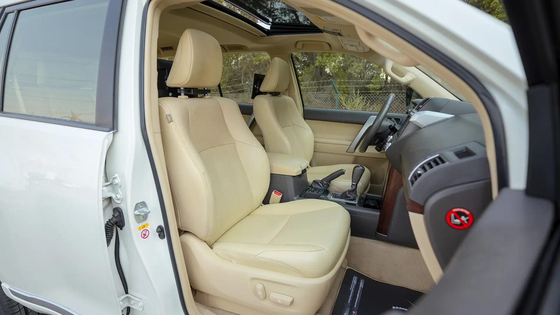 Used 2016 Toyota Prado VXR in White – Front Passenger Side Cabin View for Sale at First Choice Cars Dubai Sharjah