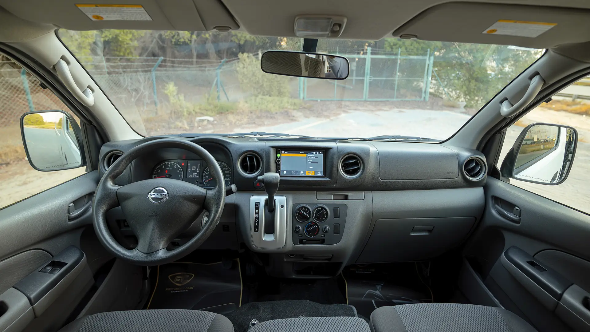 Used 2022 Nissan Urvan Standard Roof in White – Front Cabin / Dashboard Full View for Sale at First Choice Cars Dubai Sharjah