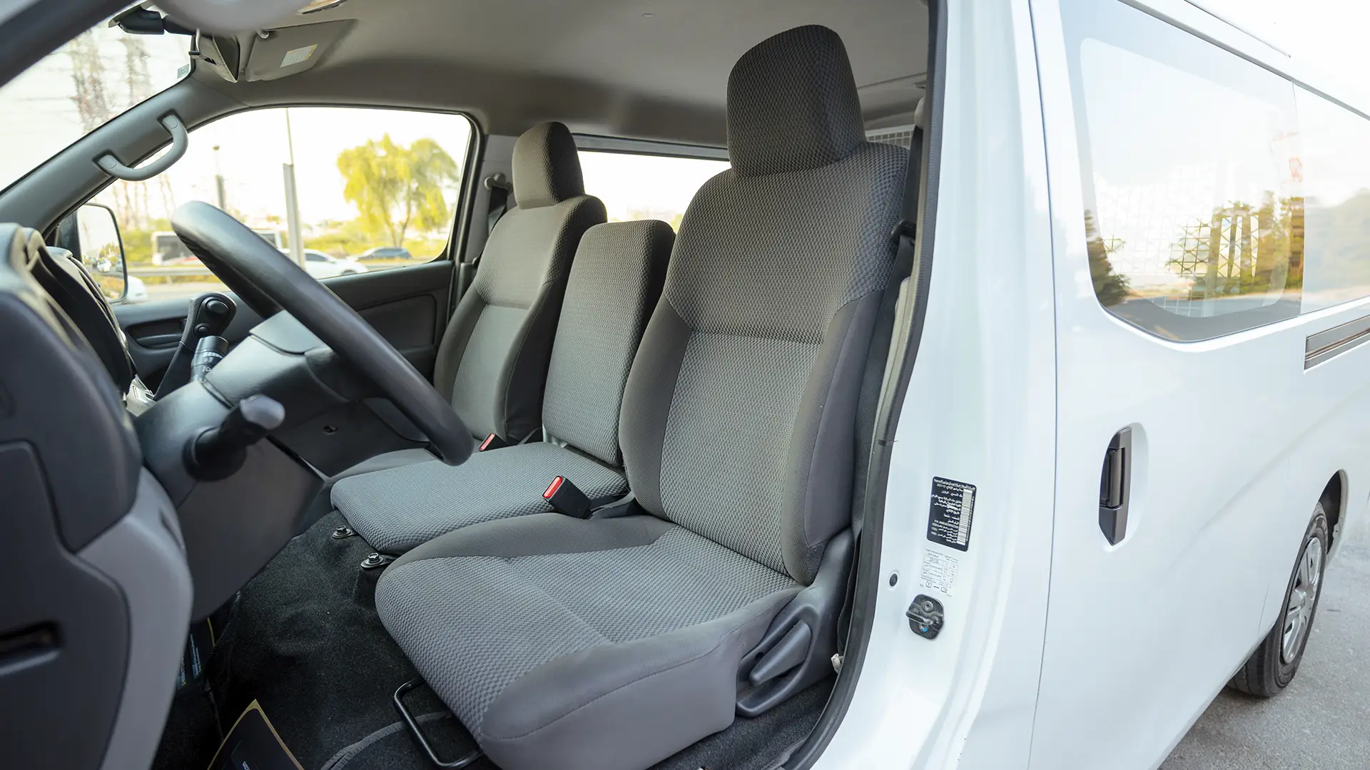 Used 2022 Nissan Urvan Standard Roof in White – Front Driver Side Cabin View for Sale at First Choice Cars Dubai Sharjah