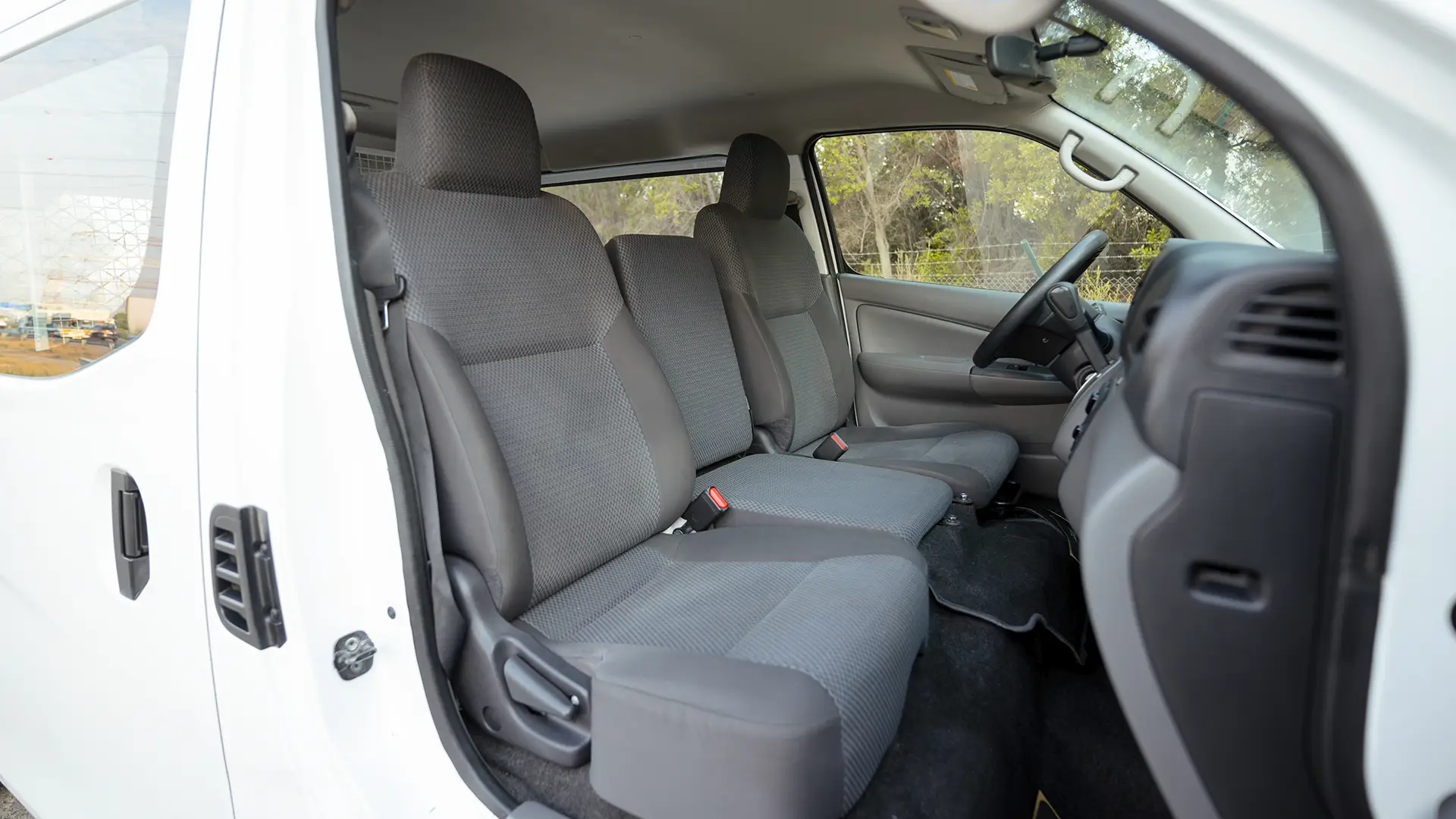 Used 2022 Nissan Urvan Standard Roof in White – Front Passenger Side Cabin View for Sale at First Choice Cars Dubai Sharjah