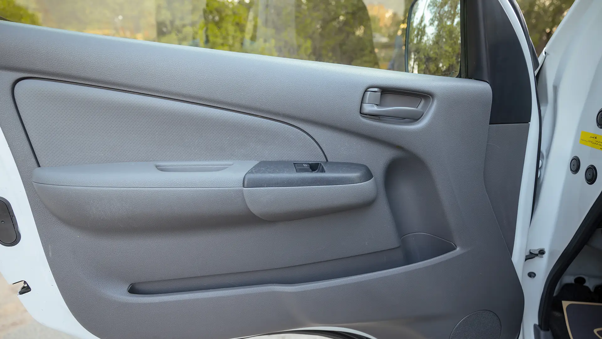 Used 2022 Nissan Urvan Standard Roof in White – Driver Door Panel Full View for Sale at First Choice Cars Dubai Sharjah