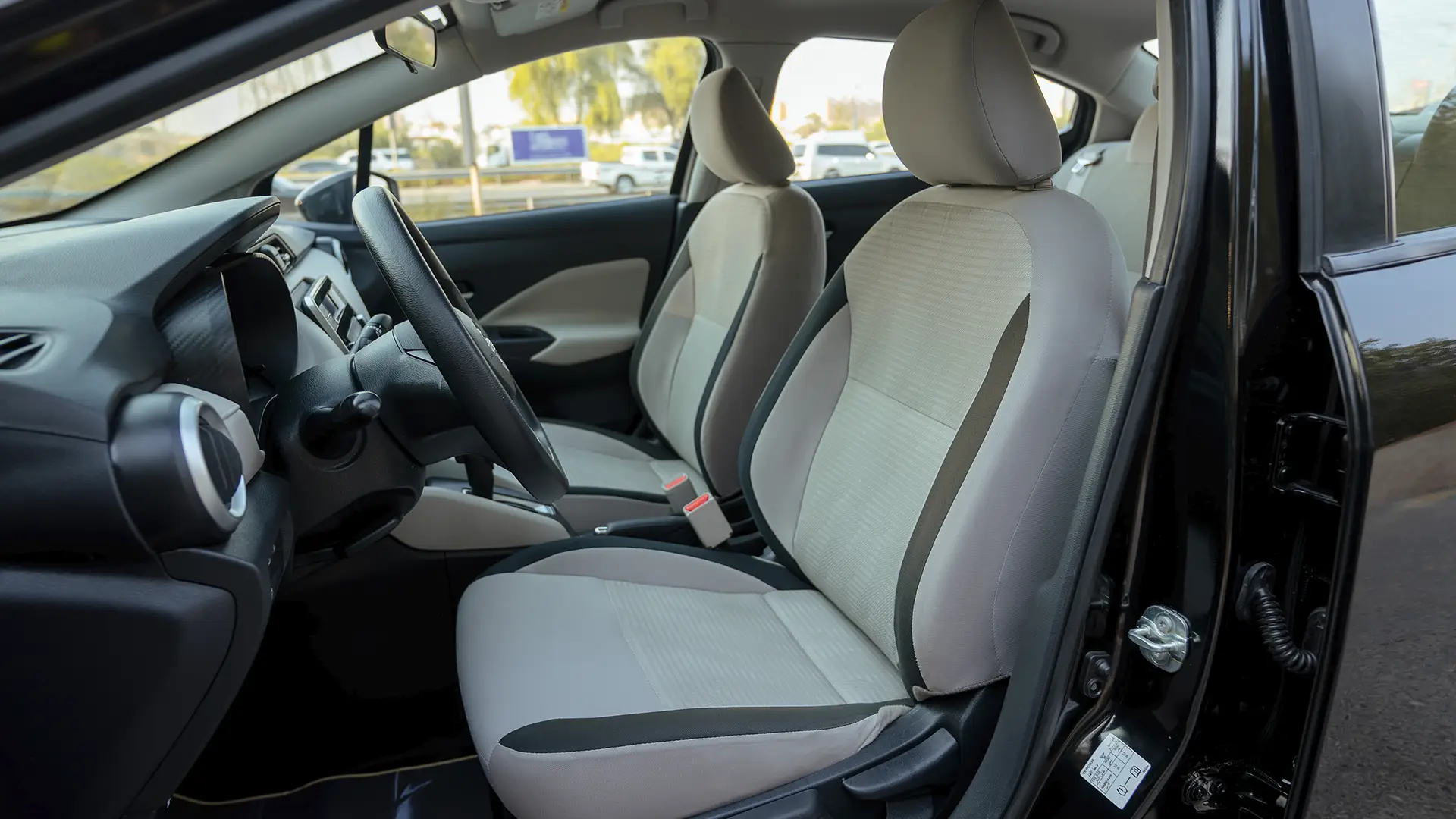 Used 2024 Nissan Sunny S in Black – Front Driver Side Cabin View for Sale at First Choice Cars Dubai Sharjah