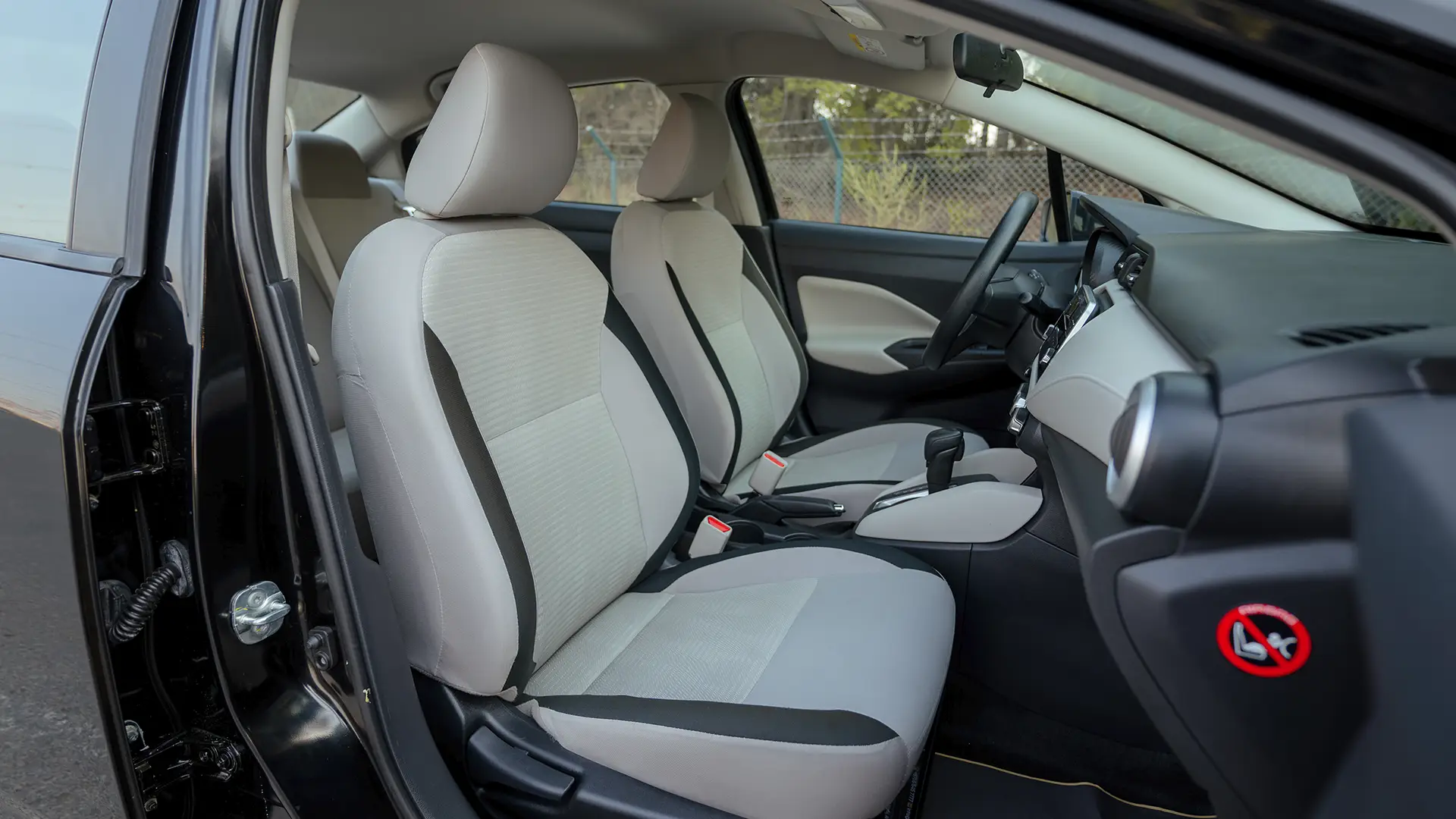 Used 2024 Nissan Sunny S in Black – Front Passenger Side Cabin View for Sale at First Choice Cars Dubai Sharjah