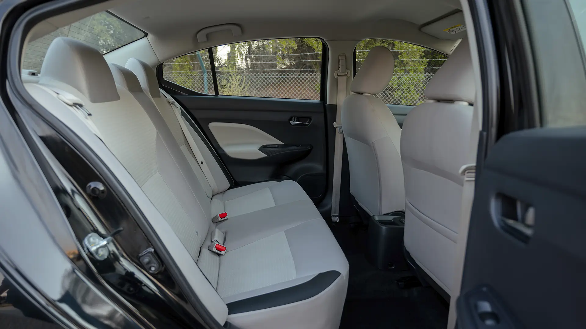 Used 2024 Nissan Sunny S in Black – Rear Passenger Side Cabin View for Sale at First Choice Cars Dubai Sharjah