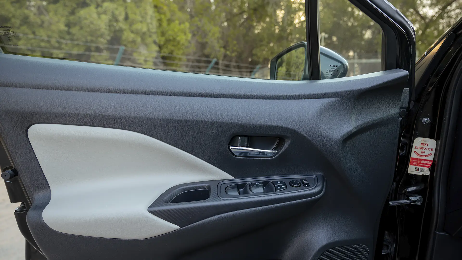Used 2024 Nissan Sunny S in Black – Driver Door Panel Full View for Sale at First Choice Cars Dubai Sharjah