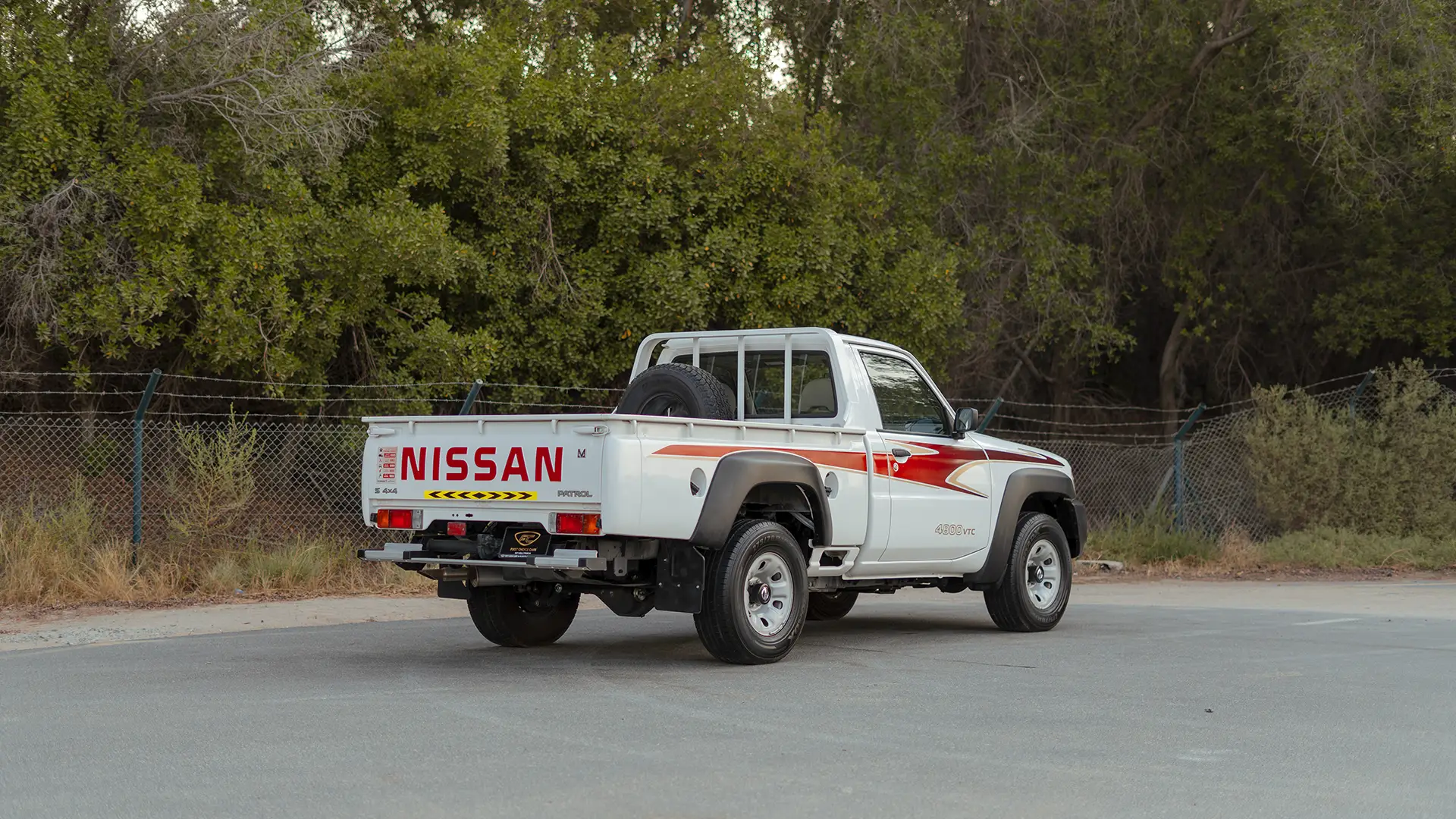 Used 2022 Nissan Patrol Pickup GL in White – Right Back Diagonal (45°) View for Sale at First Choice Cars Dubai Sharjah
