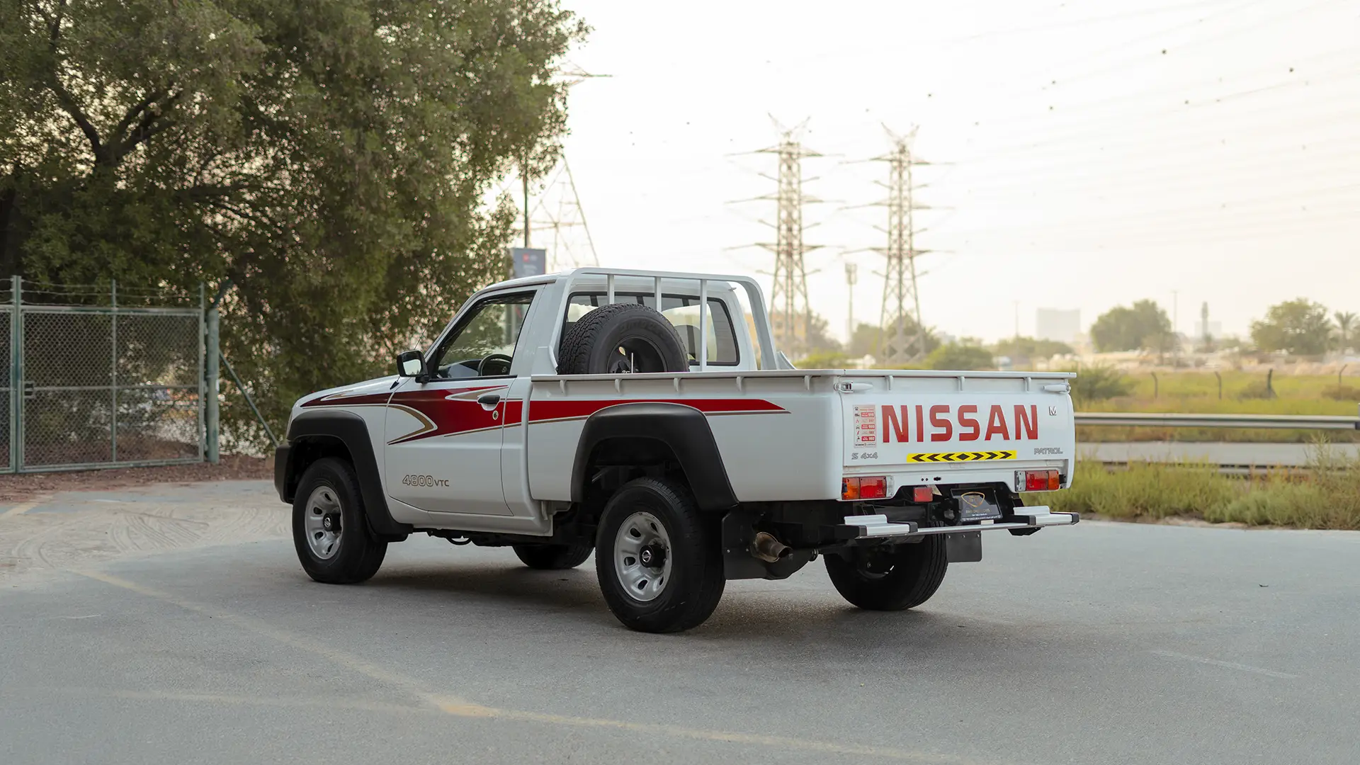 Used 2022 Nissan Patrol Pickup GL in White – Left Back Diagonal (45°) View for Sale at First Choice Cars Dubai Sharjah