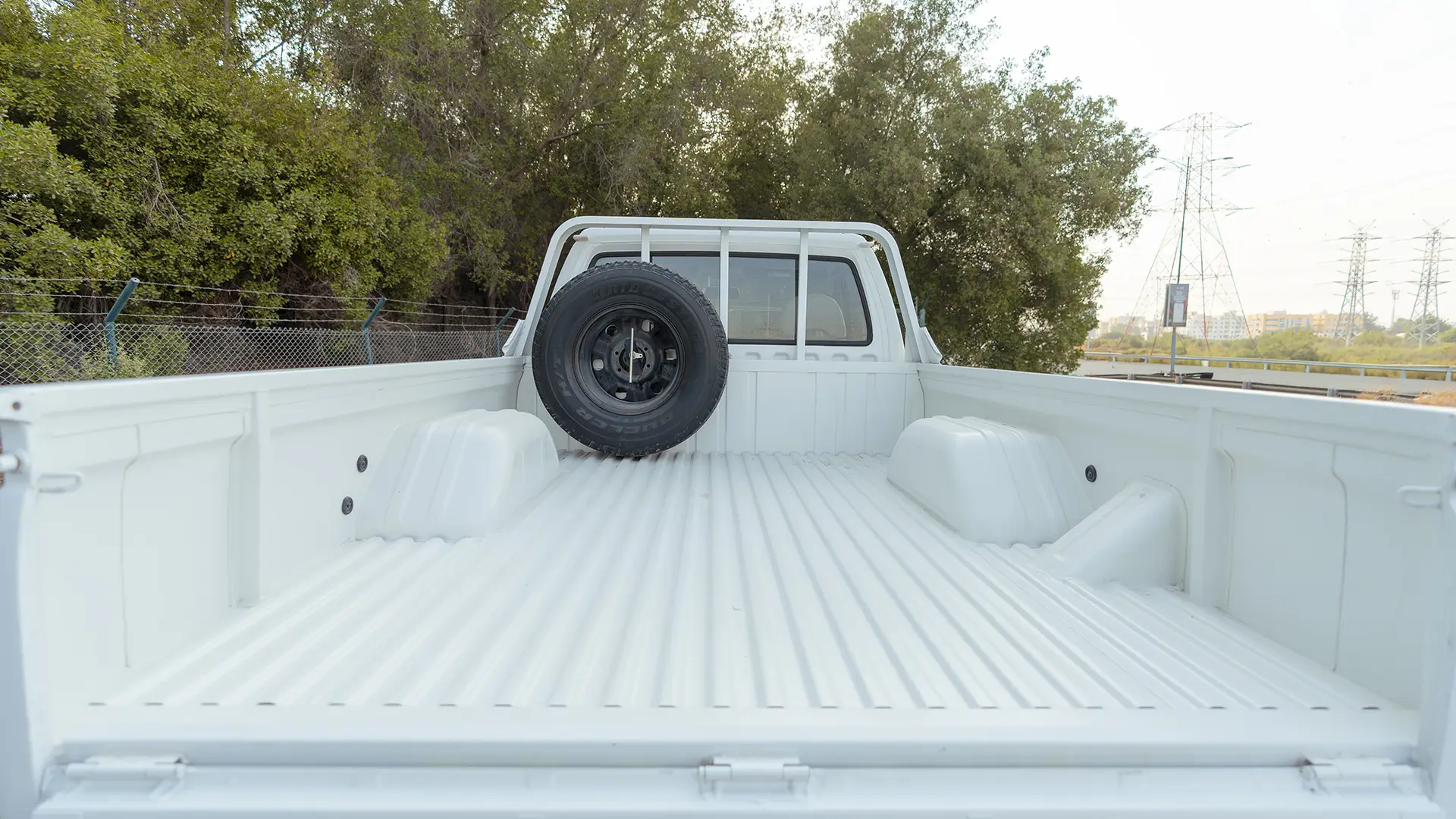 Used 2022 Nissan Patrol Pickup GL in White – Boot / Trunk Space Open View for Sale at First Choice Cars Dubai Sharjah