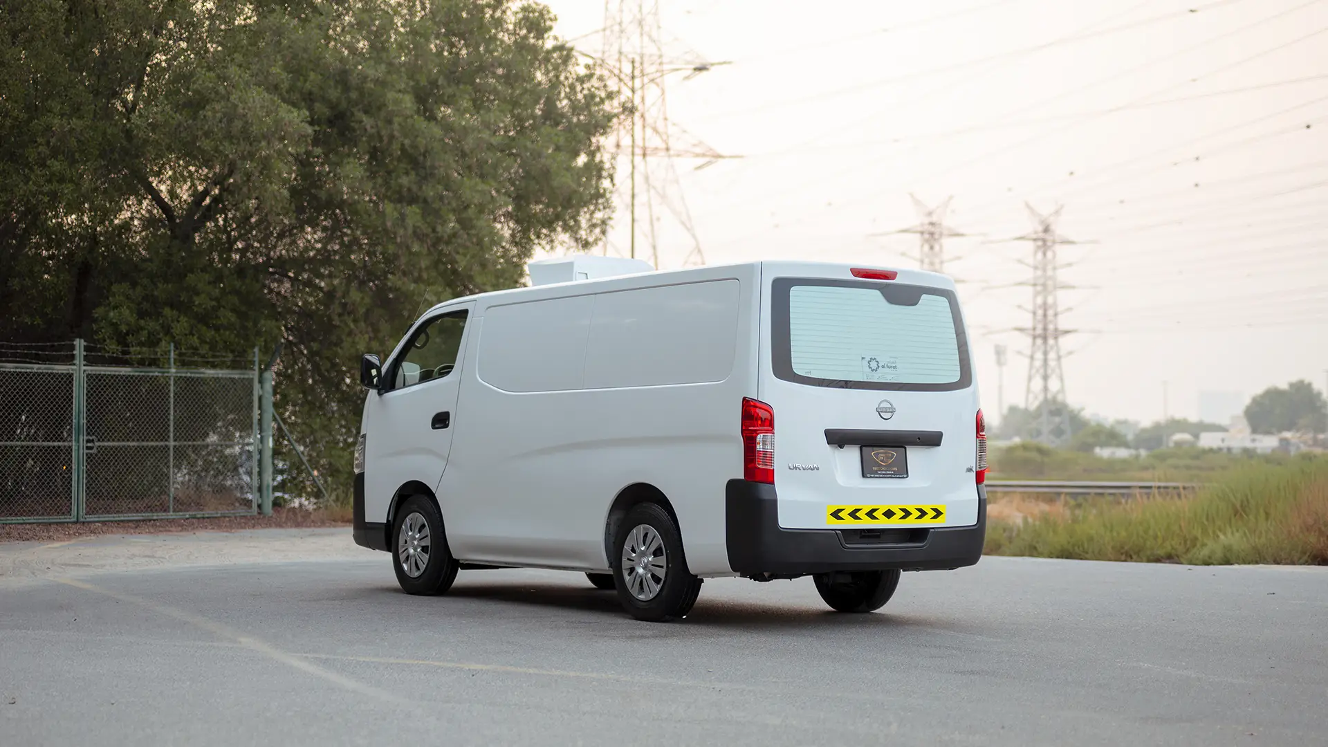 Used 2023 Nissan Urvan Standard Roof in White – Left Back Diagonal (45°) View for Sale at First Choice Cars Dubai Sharjah