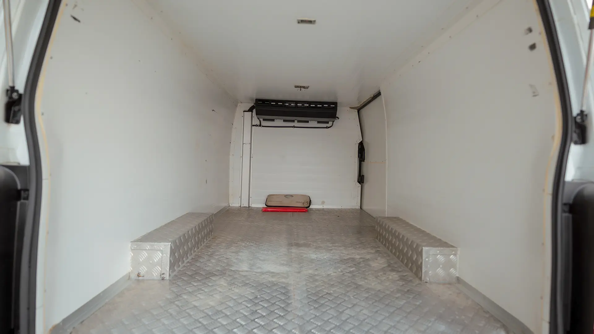 Used 2023 Nissan Urvan Standard Roof in White – Chiller Box Rear Opening View for Sale at First Choice Cars Dubai Sharjah