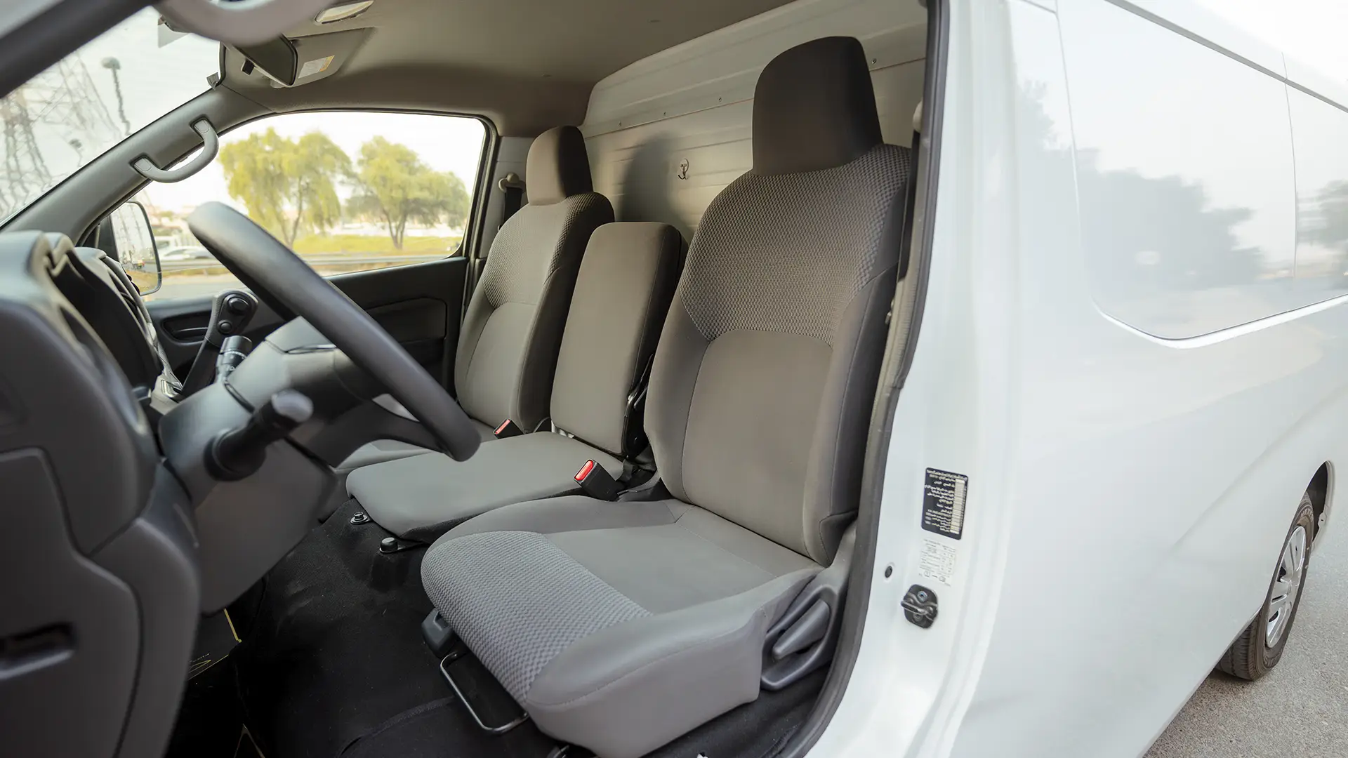 Used 2023 Nissan Urvan Standard Roof in White – Front Driver Side Cabin View for Sale at First Choice Cars Dubai Sharjah